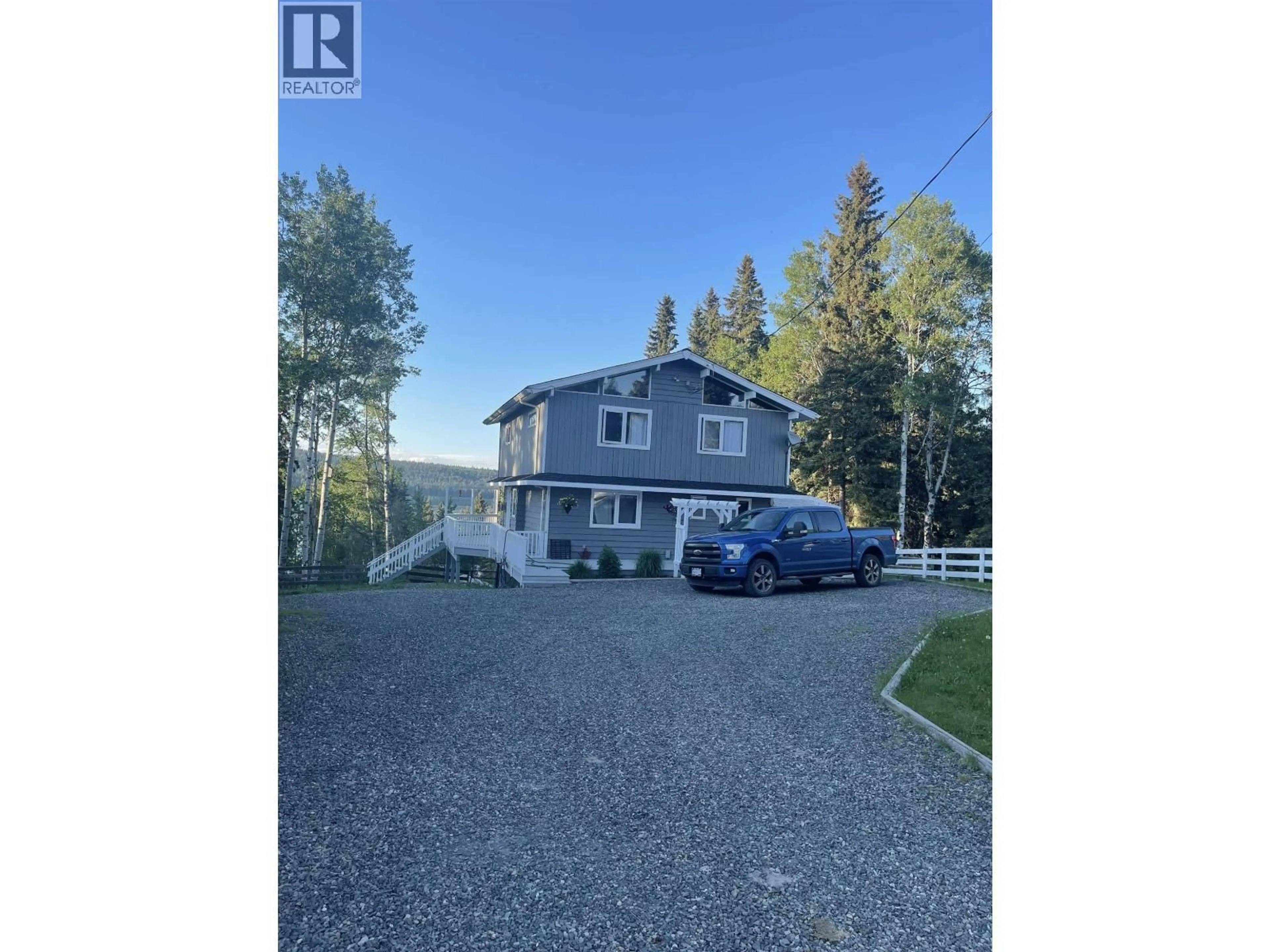 A pic from outside/outdoor area/front of a property/back of a property/a pic from drone, street for 6353 WOLFE ROAD, 100 Mile House British Columbia V0K2E3
