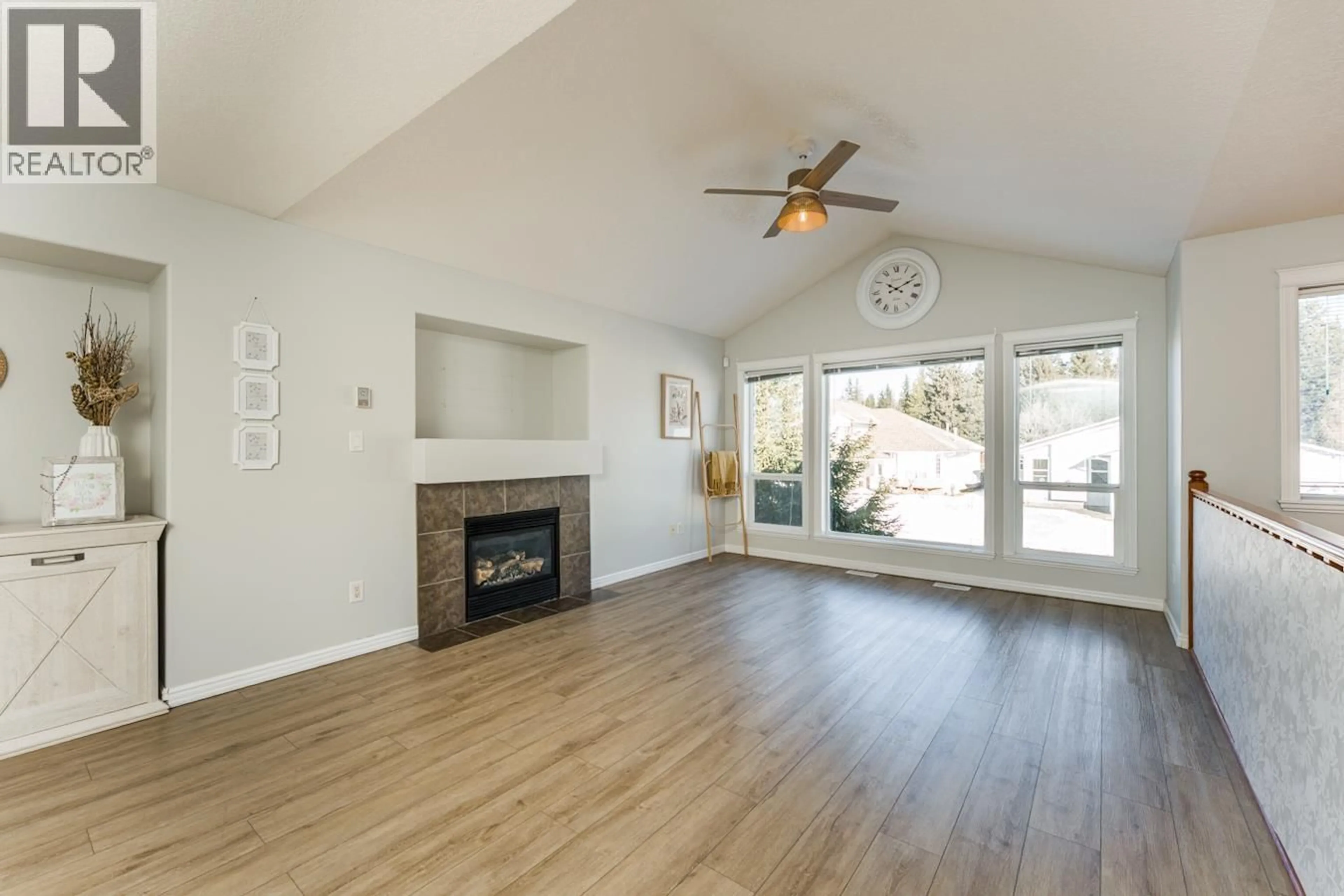 Living room with furniture, wood/laminate floor for 5745 KOVACHICH DRIVE, Prince George British Columbia V2N6S8