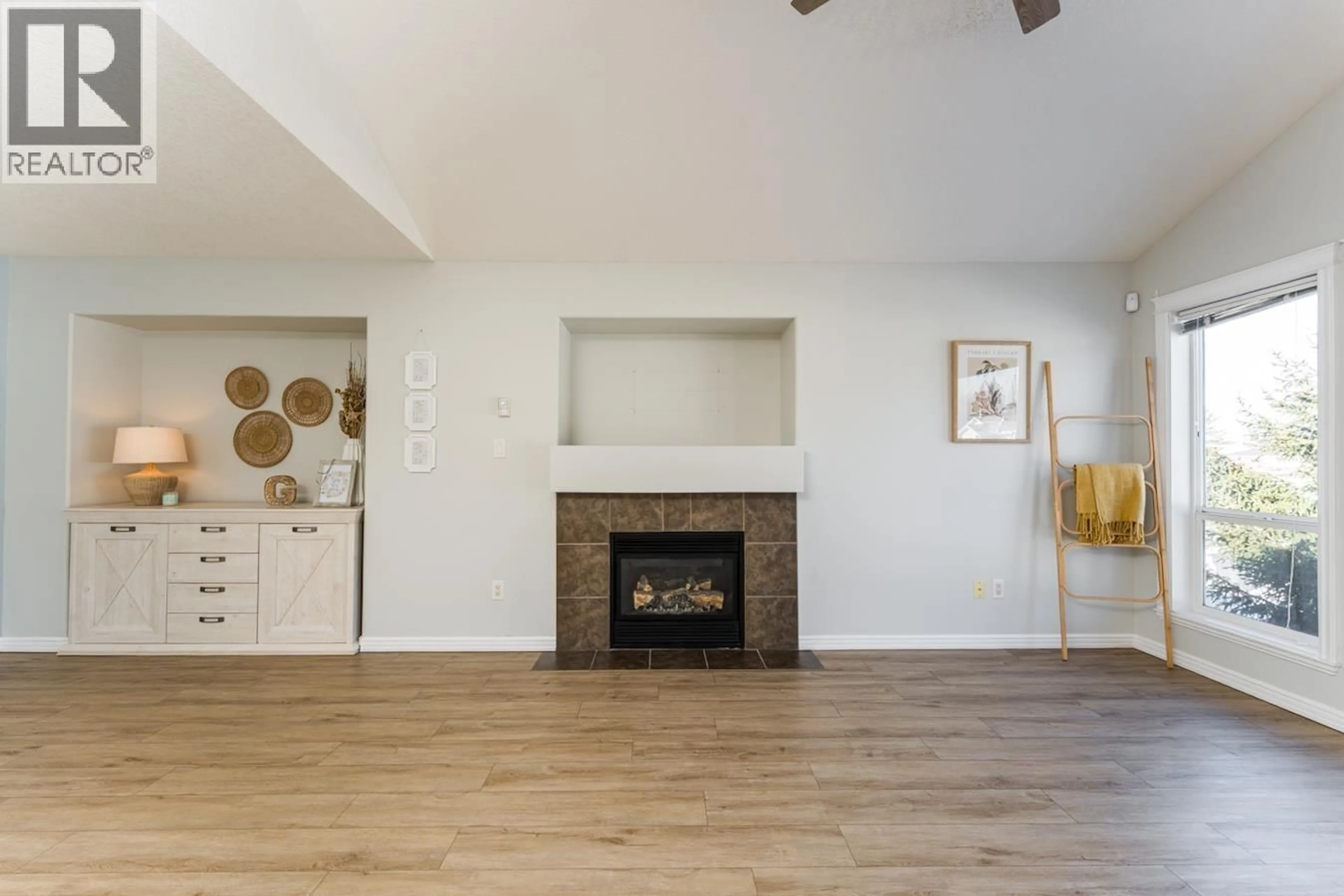 Living room with furniture, wood/laminate floor for 5745 KOVACHICH DRIVE, Prince George British Columbia V2N6S8