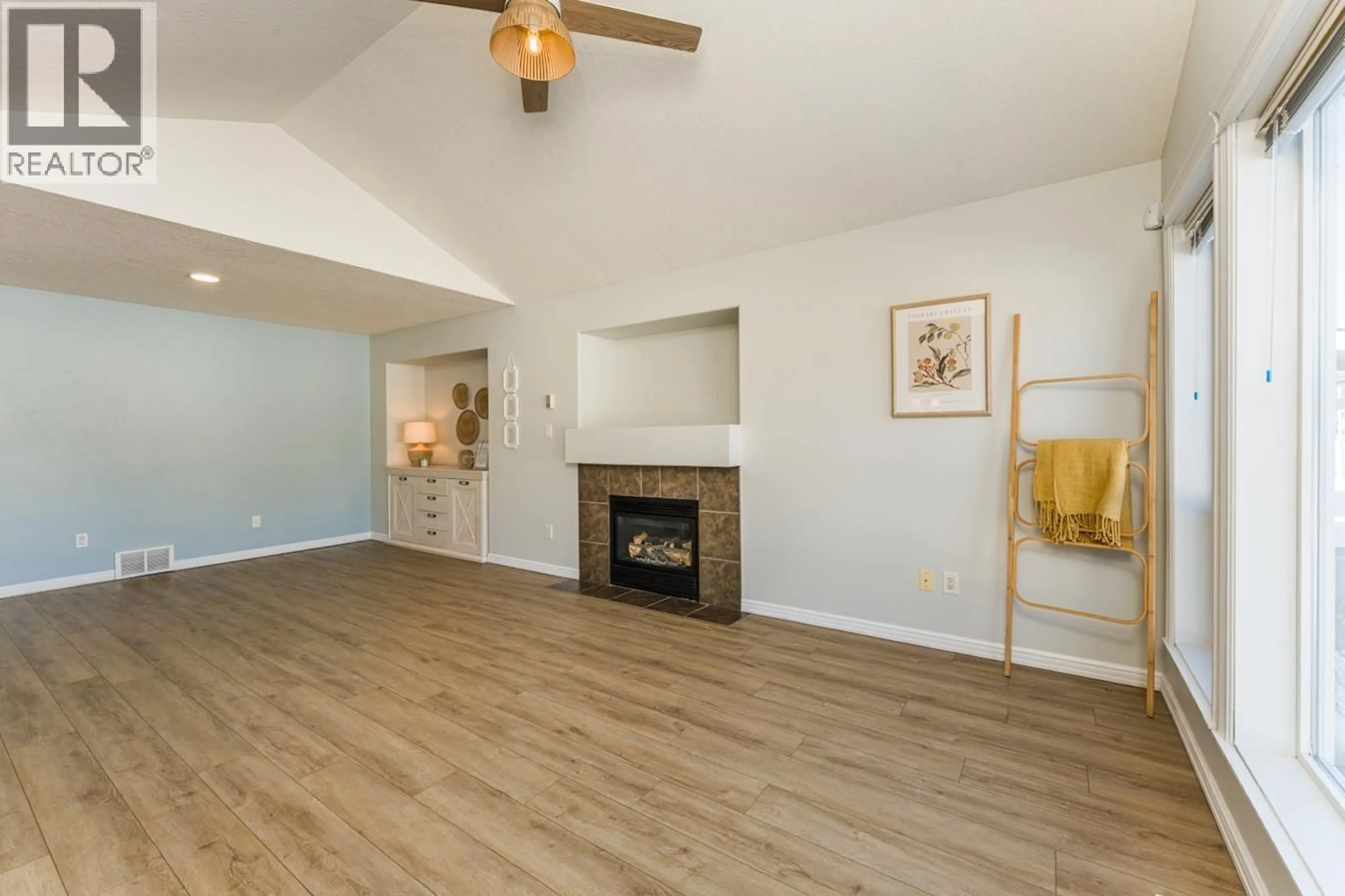 Living room with furniture, wood/laminate floor for 5745 KOVACHICH DRIVE, Prince George British Columbia V2N6S8