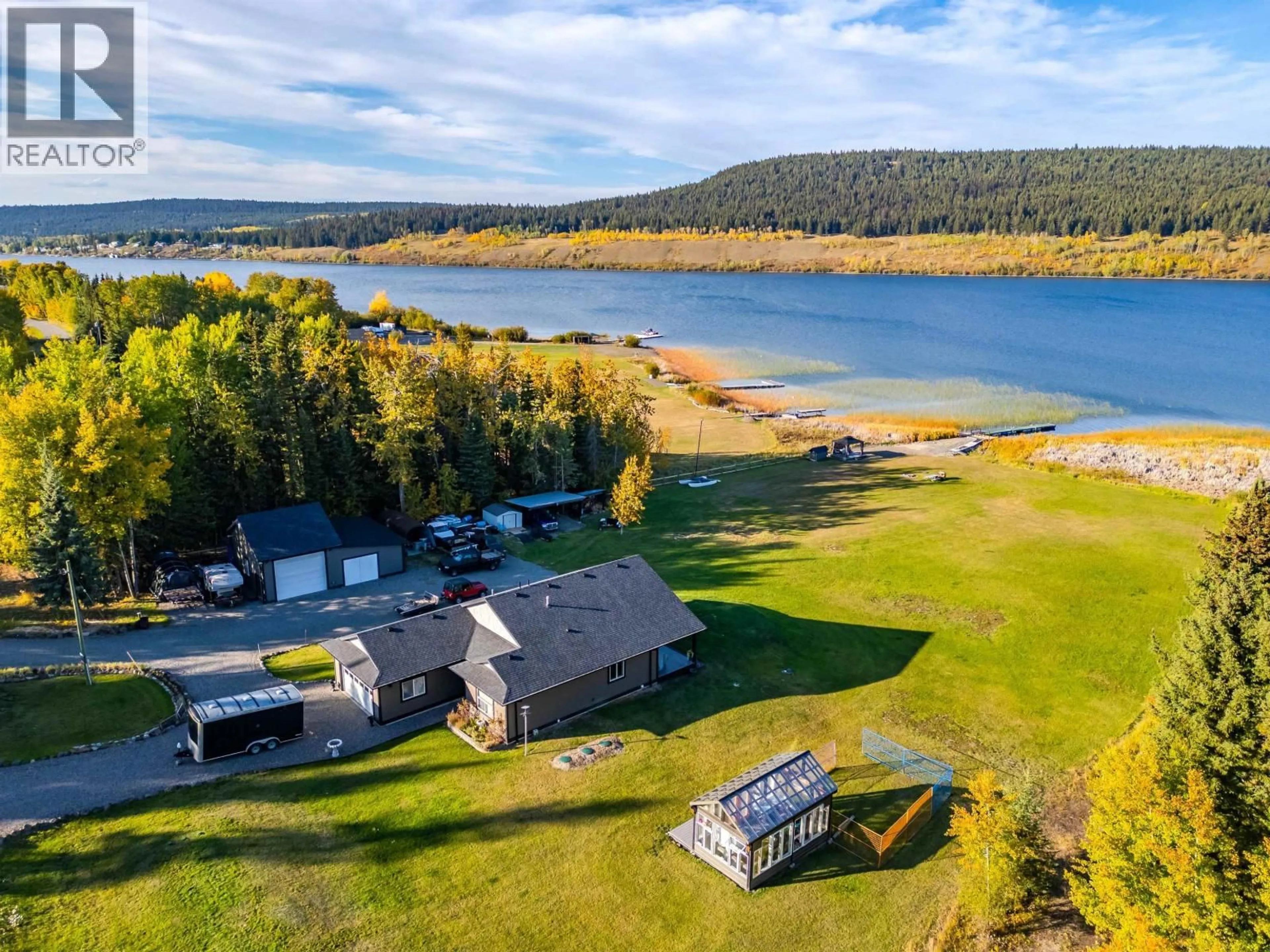 A pic from outside/outdoor area/front of a property/back of a property/a pic from drone, water/lake/river/ocean view for 6199 HUNT ROAD, 100 Mile House British Columbia V0K2E3