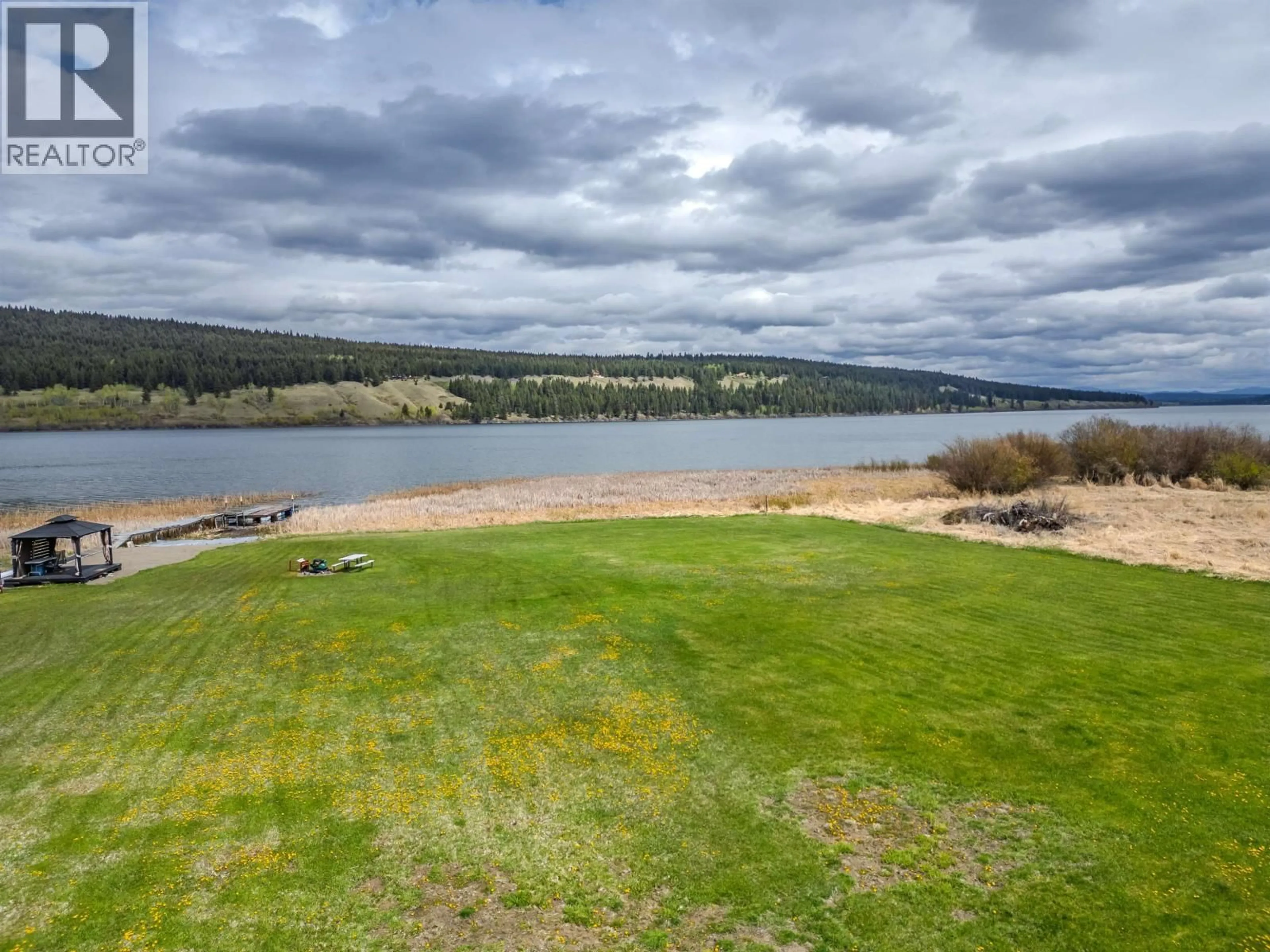 A pic from outside/outdoor area/front of a property/back of a property/a pic from drone, water/lake/river/ocean view for 6199 HUNT ROAD, 100 Mile House British Columbia V0K2E3