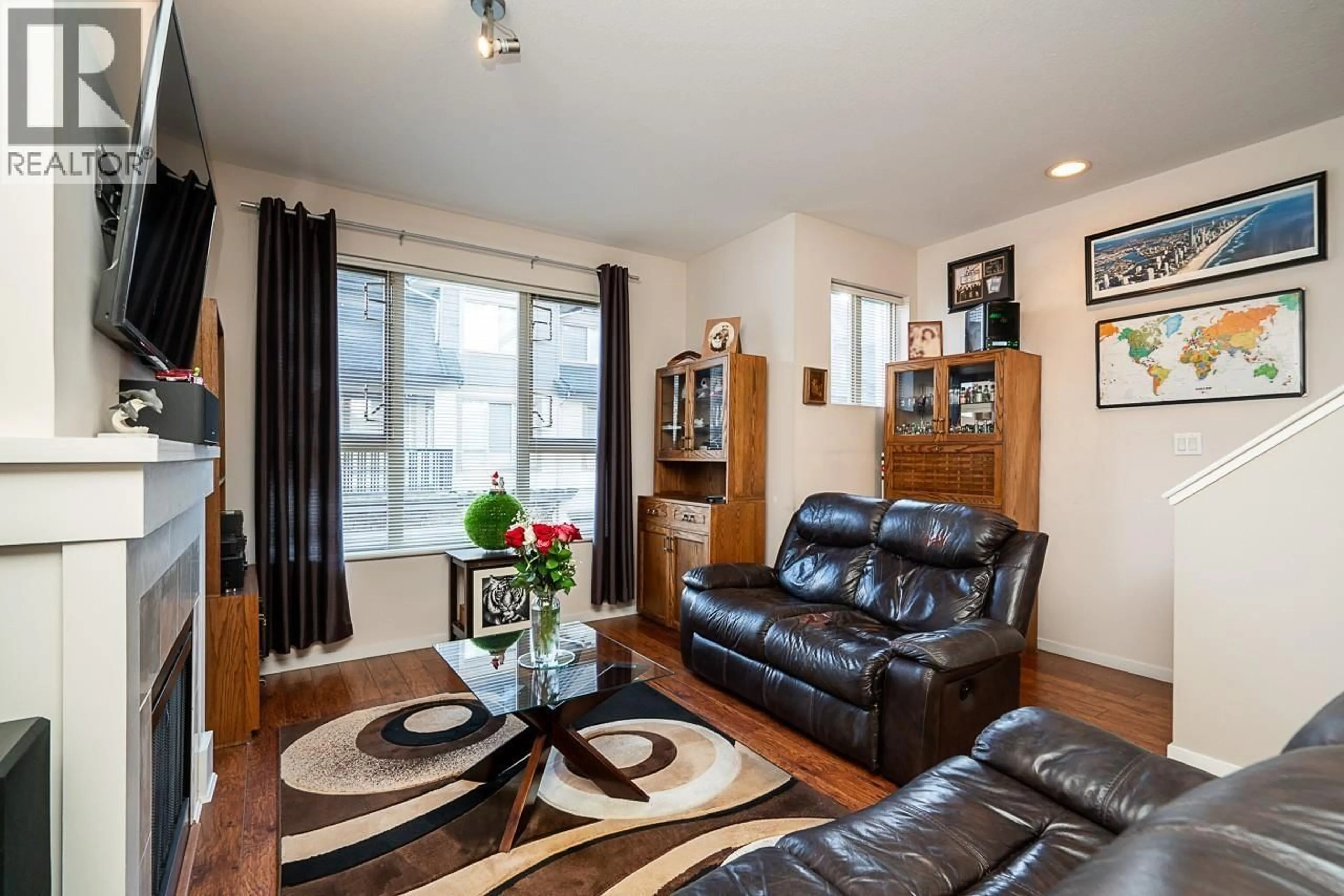 Living room with furniture, wood/laminate floor for 57 - 1370 PURCELL DRIVE, Coquitlam British Columbia V3E0A5