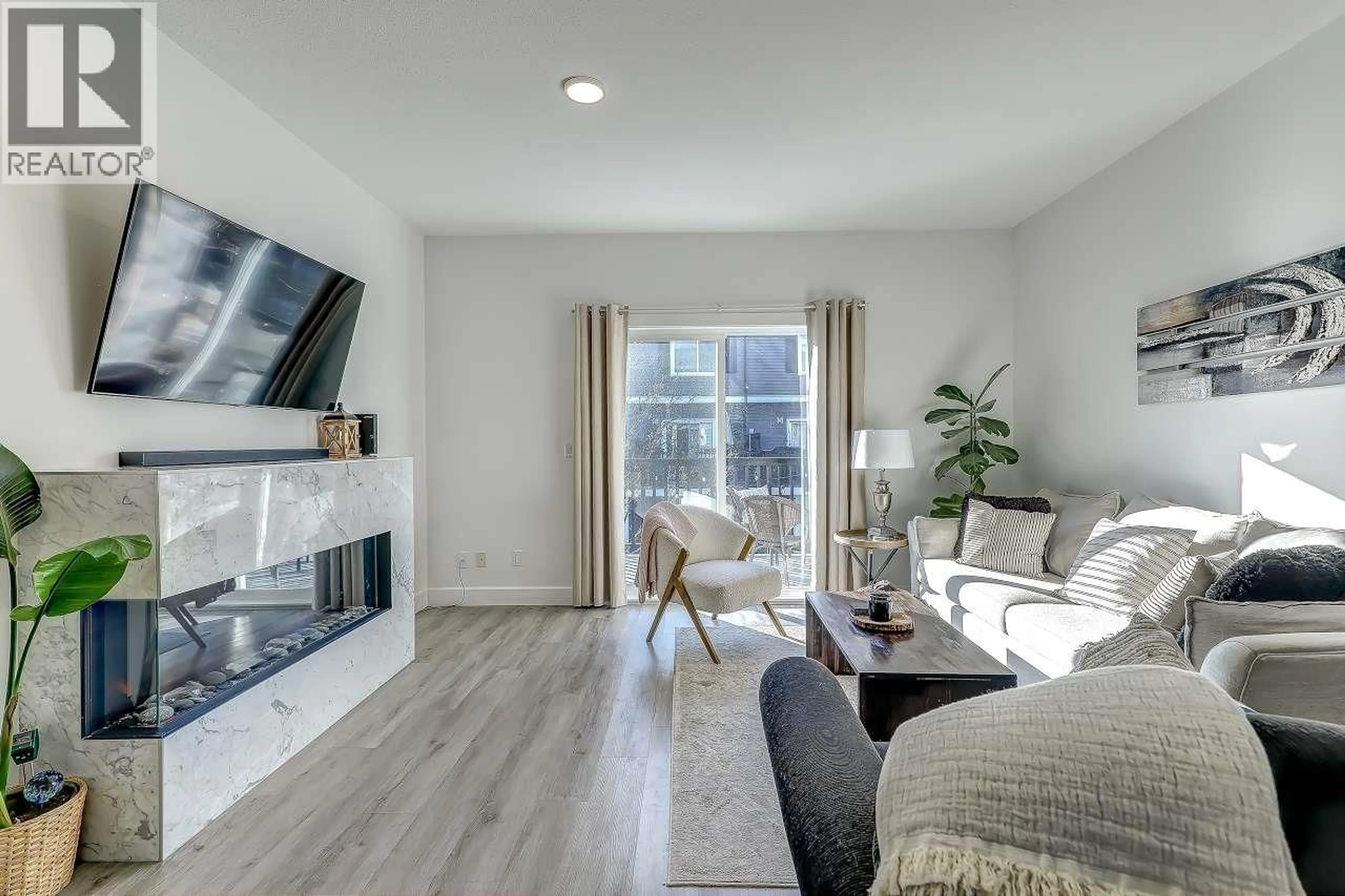 Living room with furniture, wood/laminate floor for 53 - 19572 FRASER WAY, Pitt Meadows British Columbia V3Y0A9