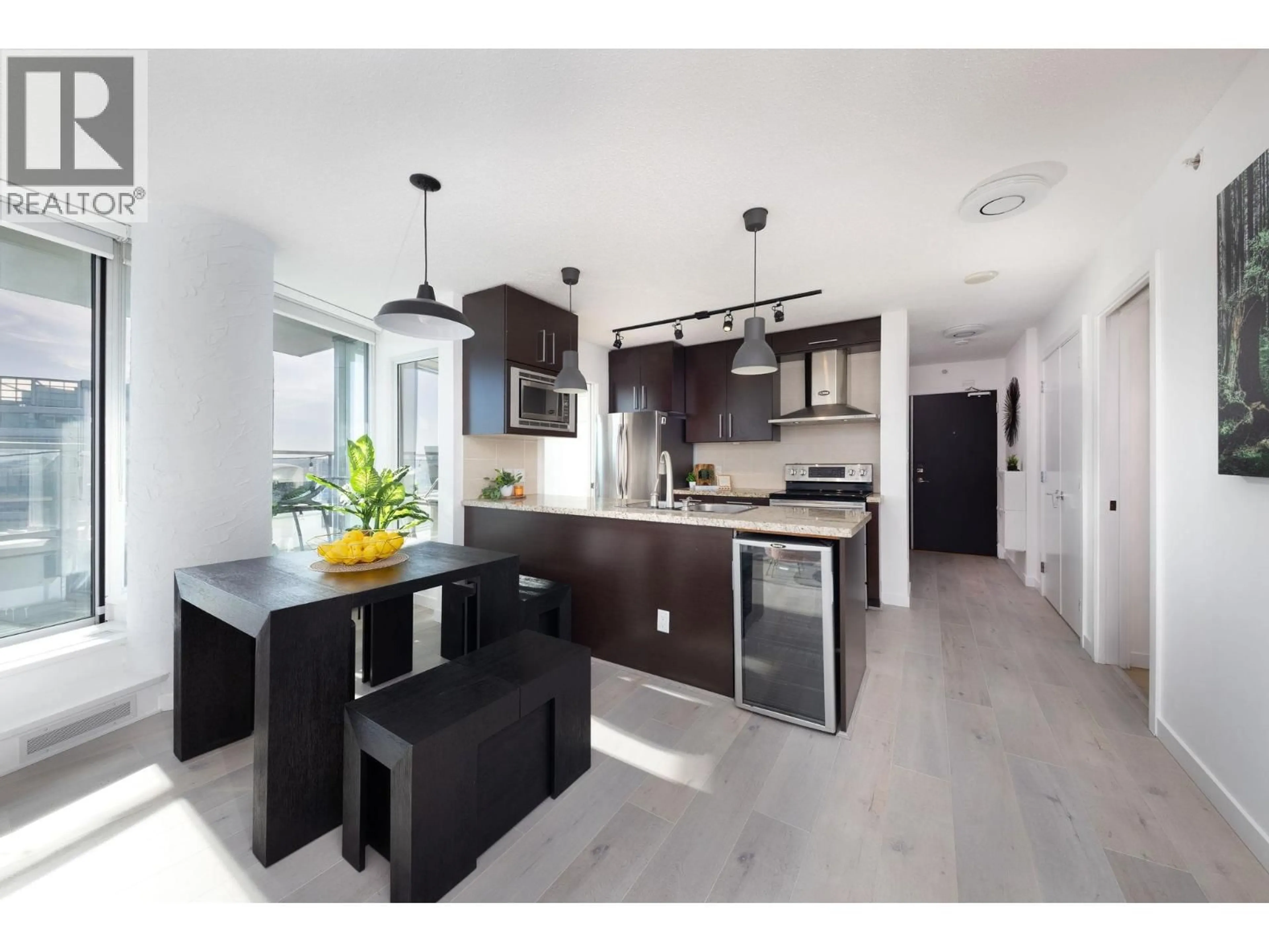 Open concept kitchen, wood/laminate floor for 3705 - 188 KEEFER PLACE, Vancouver British Columbia V6B0J1