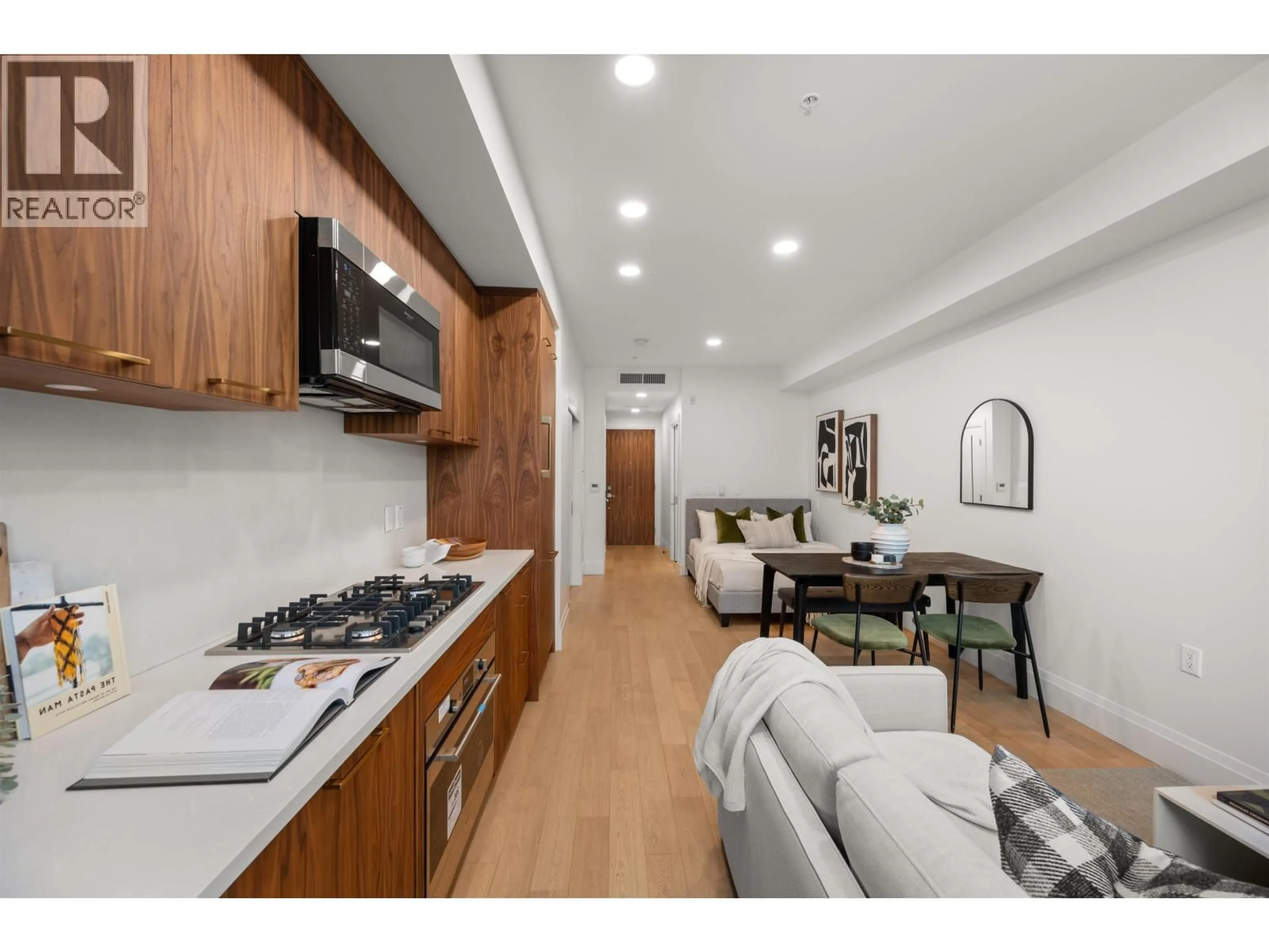 Open concept kitchen, wood/laminate floor for 410 - 2550 GARDEN DRIVE, Vancouver British Columbia V5N4X6