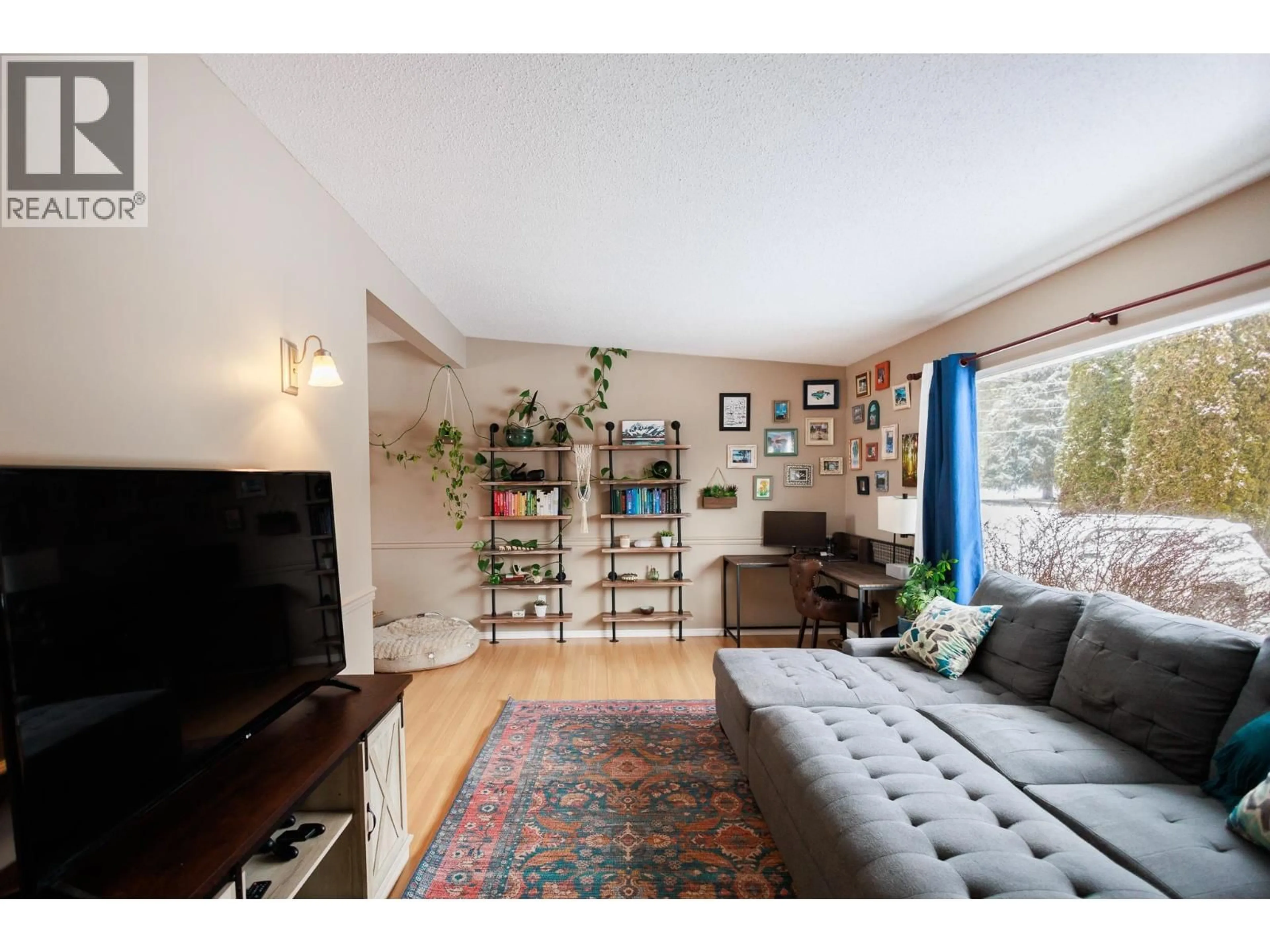 Living room with furniture, wood/laminate floor for 4115 BENNER STREET, Terrace British Columbia V8G3B1