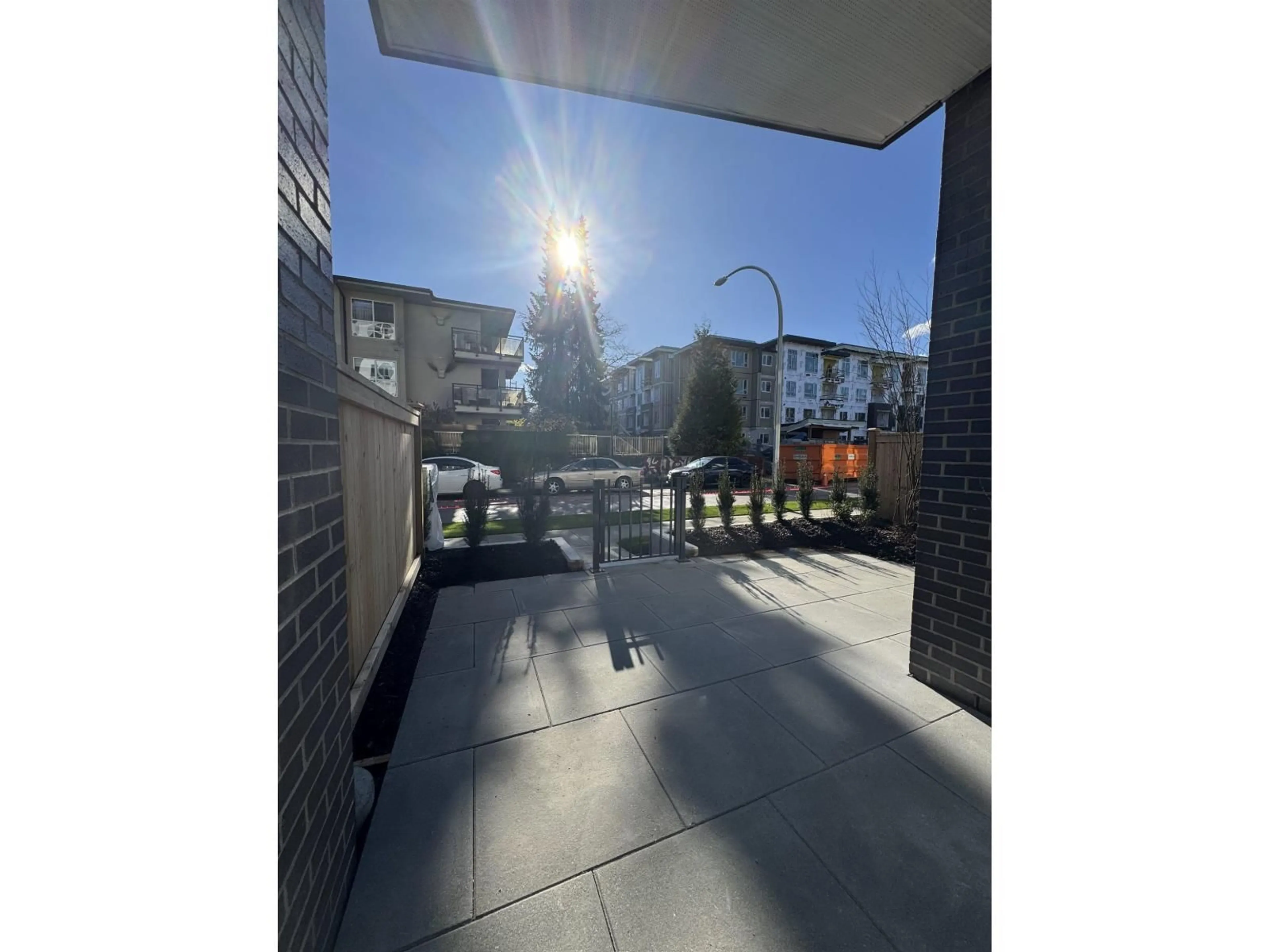 Patio, city buildings view from balcony for 117 - 13777 75A AVENUE, Surrey British Columbia V3W3W4