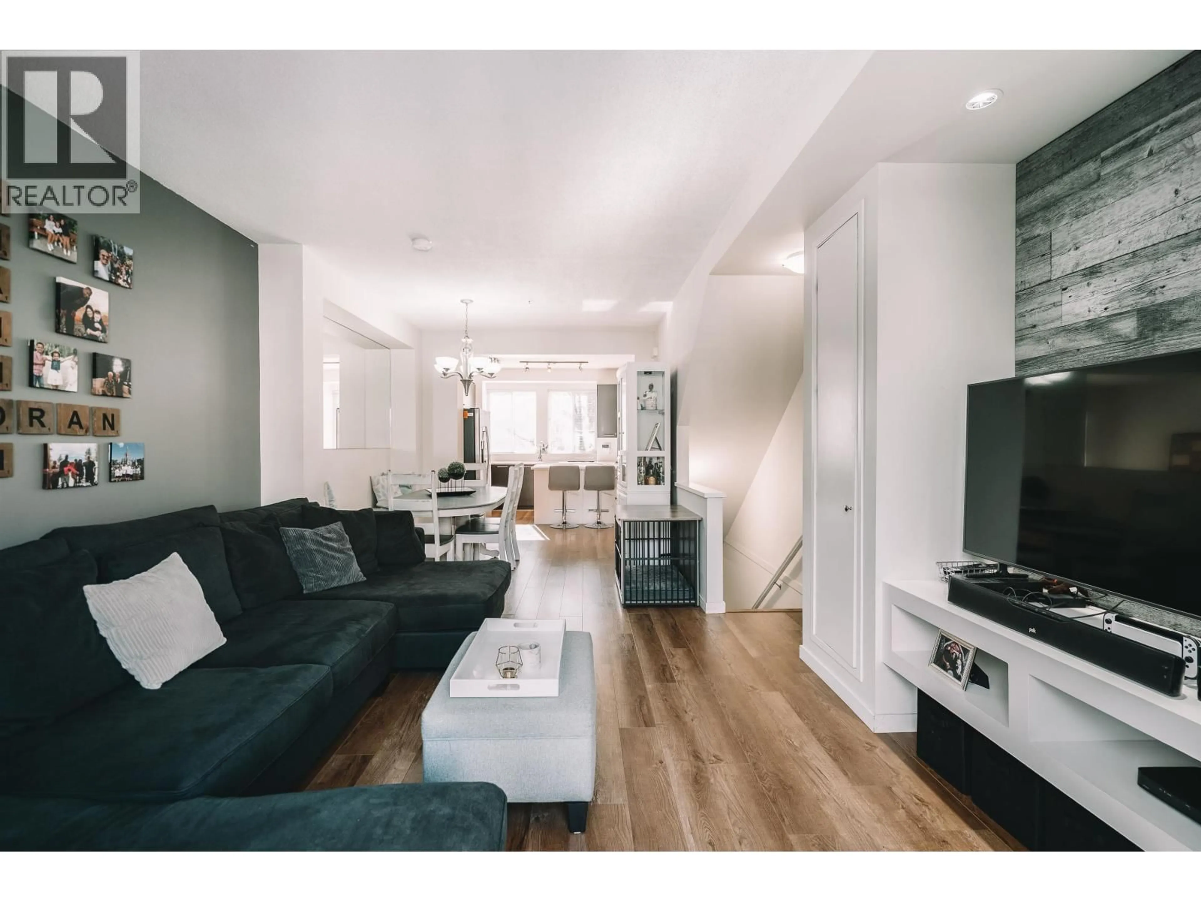 Living room with furniture, wood/laminate floor for 136 - 2418 AVON PLACE, Port Coquitlam British Columbia V3B0C7