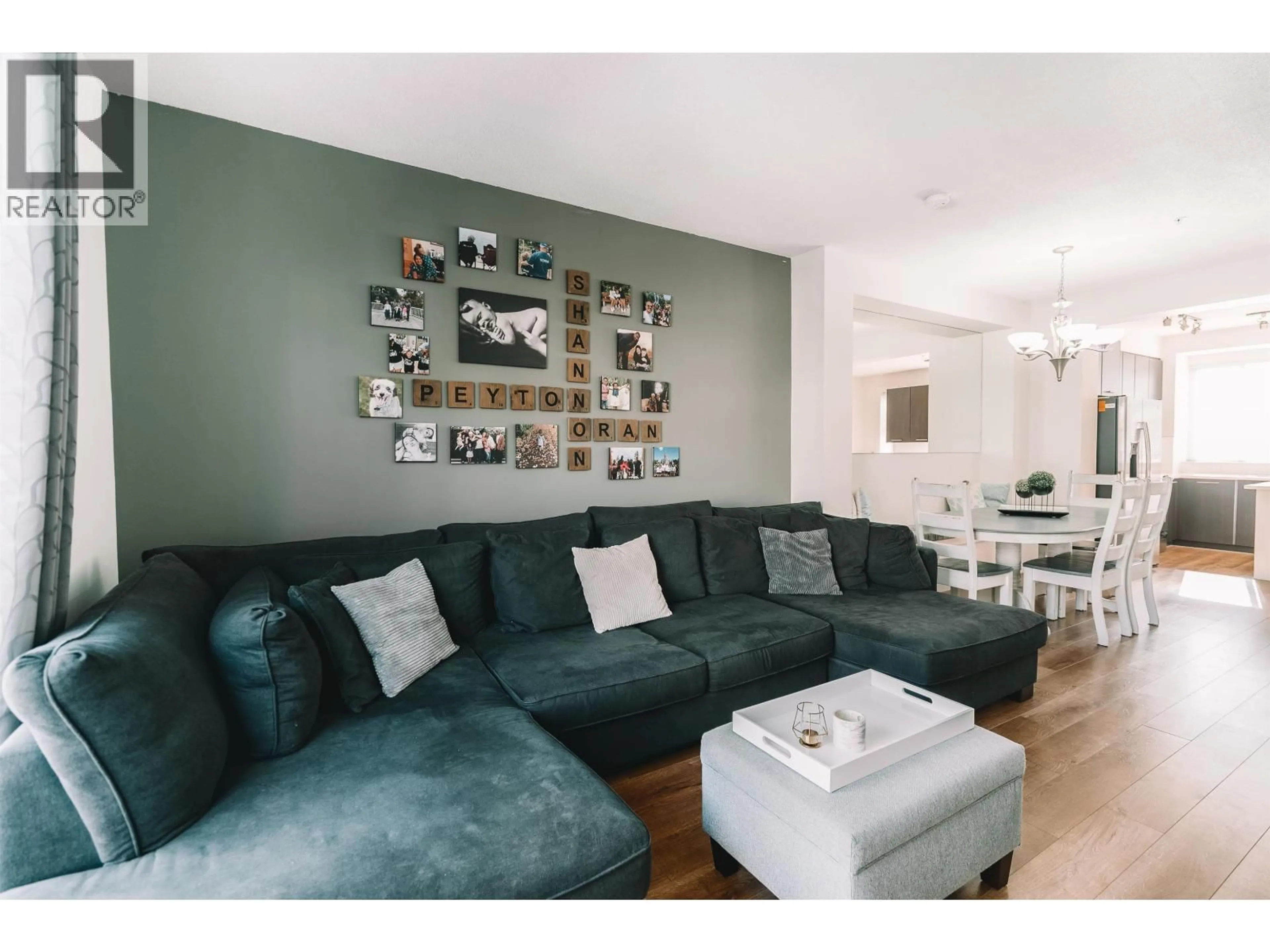 Living room with furniture, wood/laminate floor for 136 - 2418 AVON PLACE, Port Coquitlam British Columbia V3B0C7