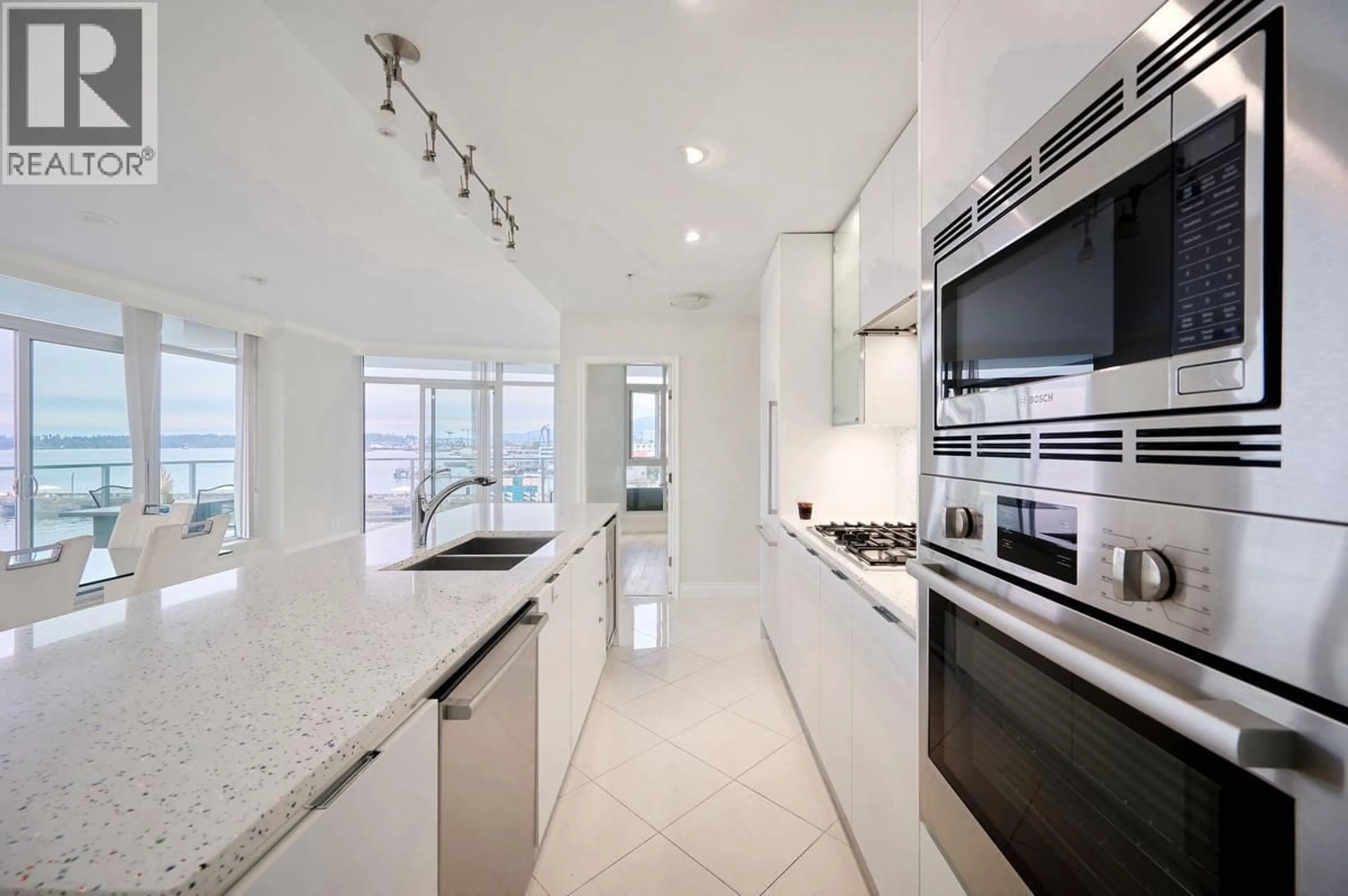 Contemporary kitchen, ceramic/tile floor for 401 - 199 VICTORY SHIP WAY, North Vancouver British Columbia V7L0B5