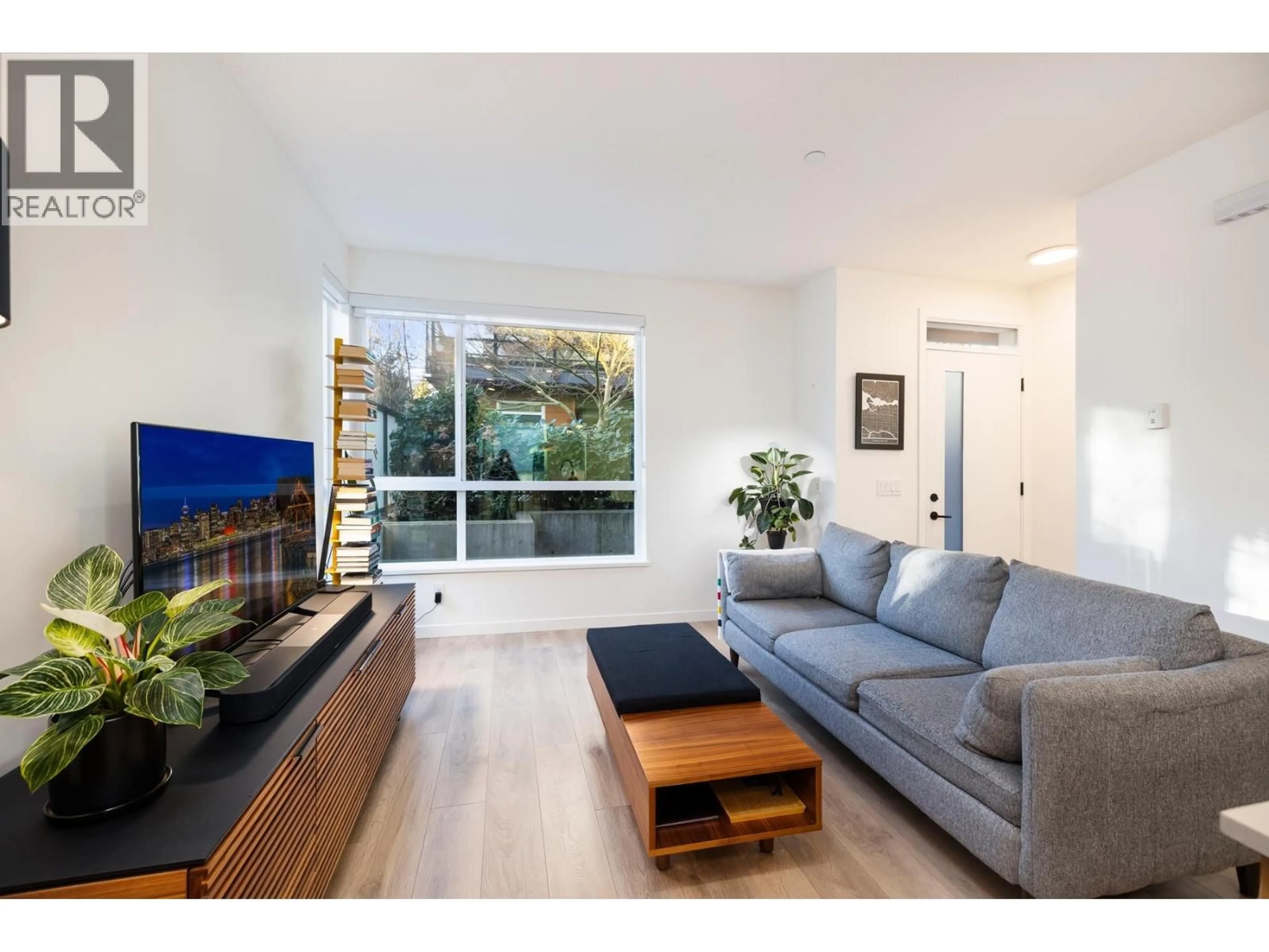 Living room with furniture, wood/laminate floor for 13 - 533 3RD STREET, North Vancouver British Columbia V7L1G4