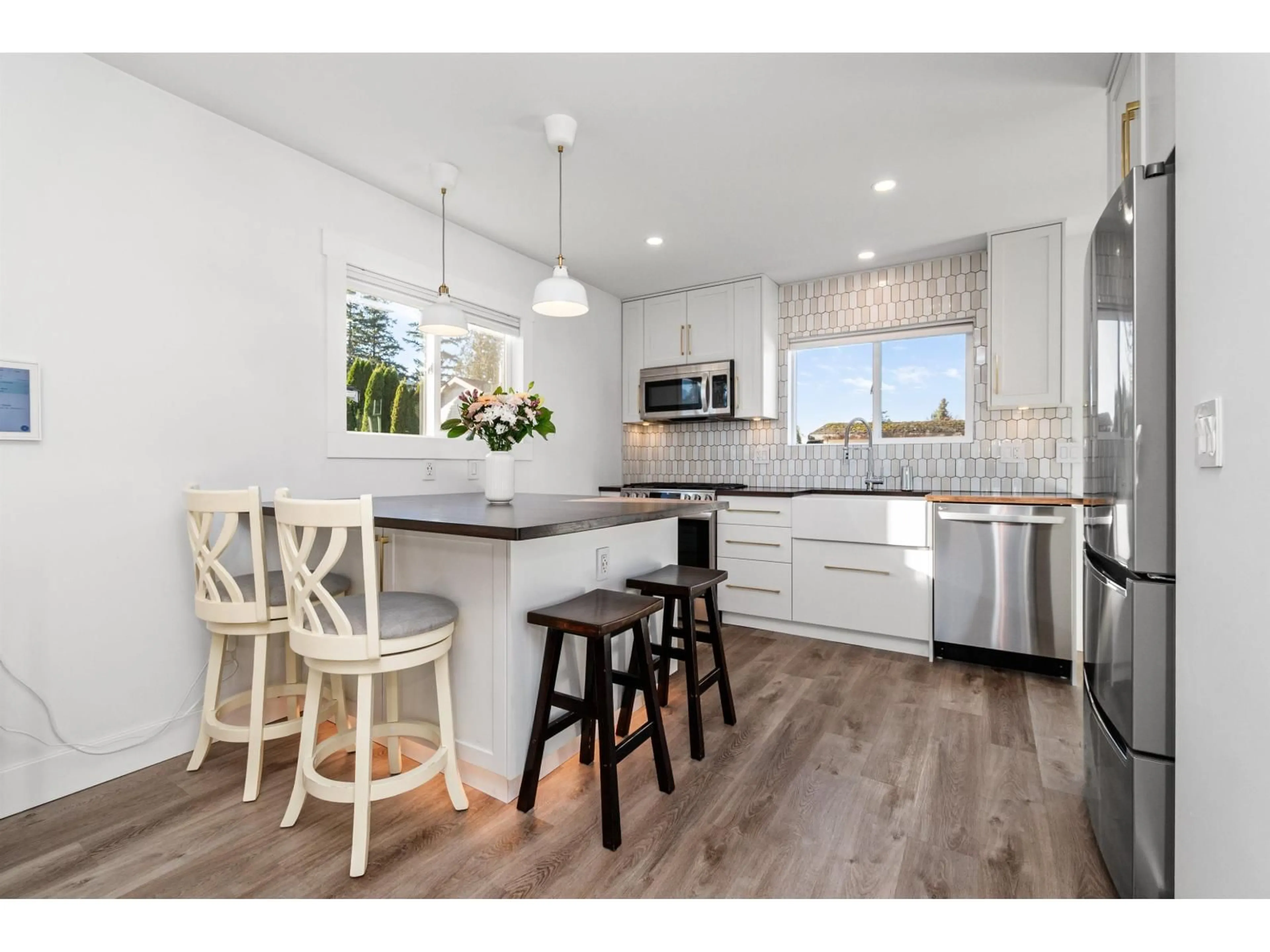 Open concept kitchen, wood/laminate floor for 5865 CARTER ROAD, Chilliwack British Columbia V2R3K1