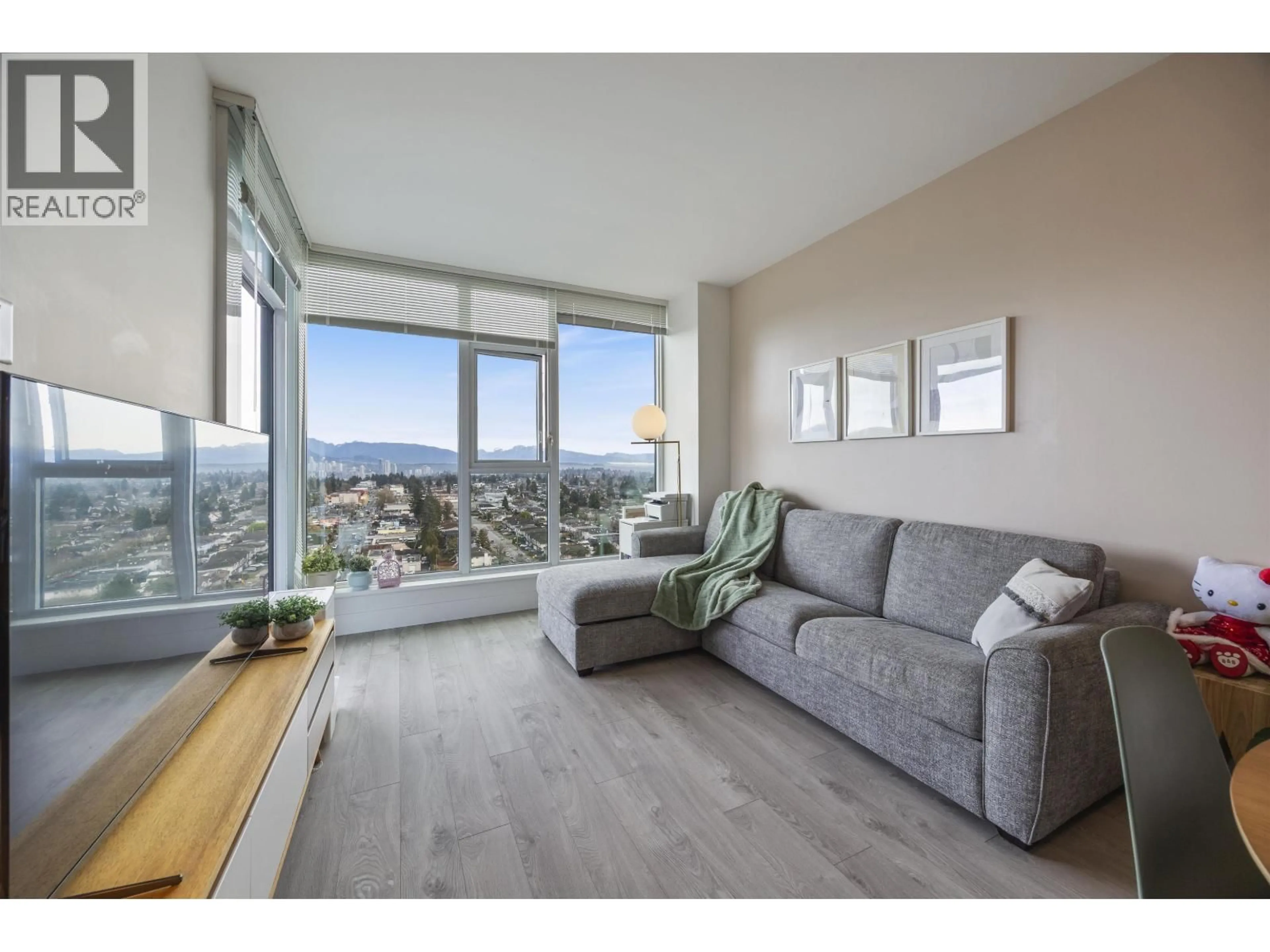 Living room with furniture, wood/laminate floor for 2106 - 7303 NOBLE LANE, Burnaby British Columbia V3N0H2