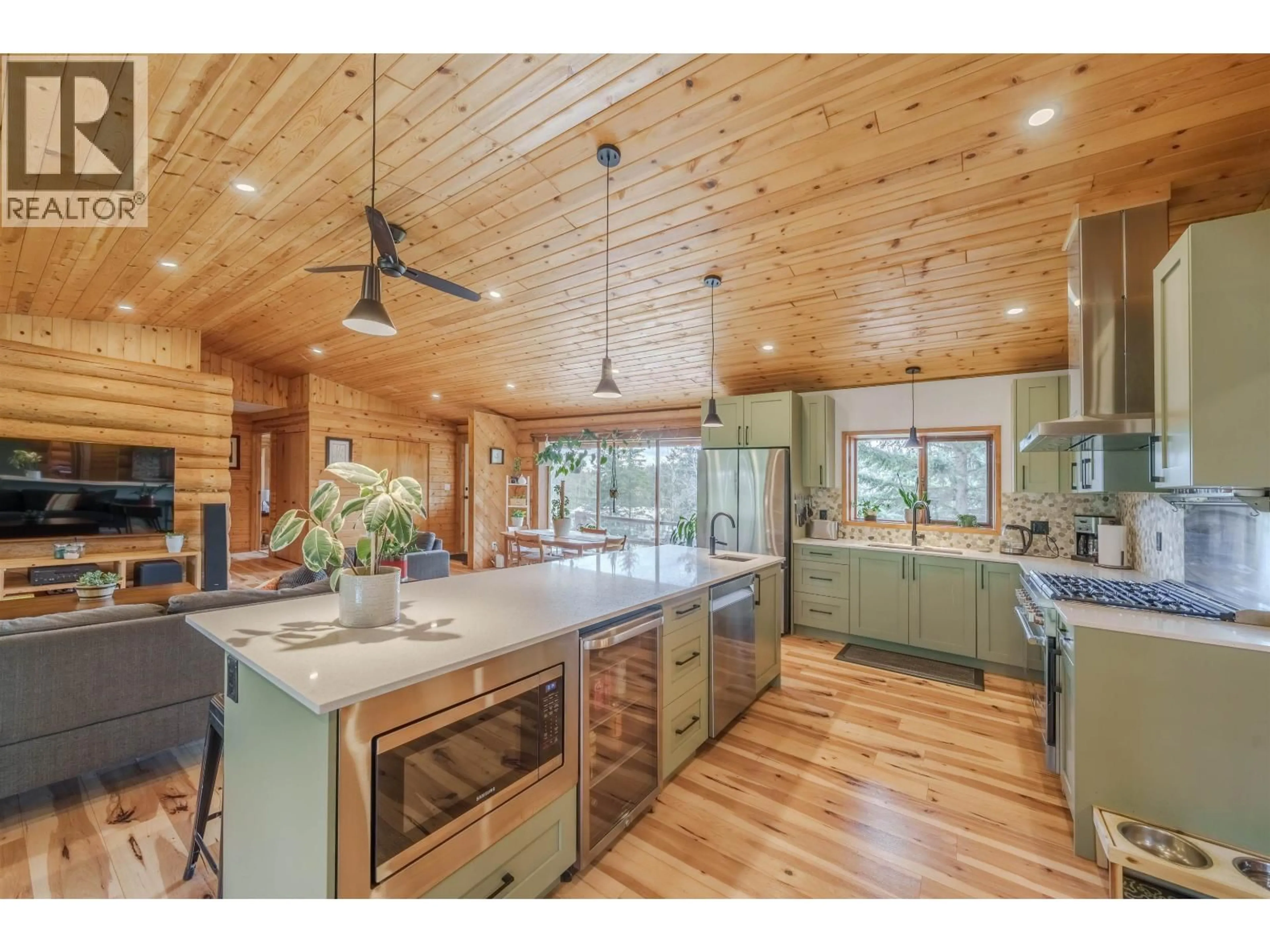 Open concept kitchen, wood/laminate floor for 5172 KALLUM DRIVE, 108 Mile Ranch British Columbia V0K2Z0