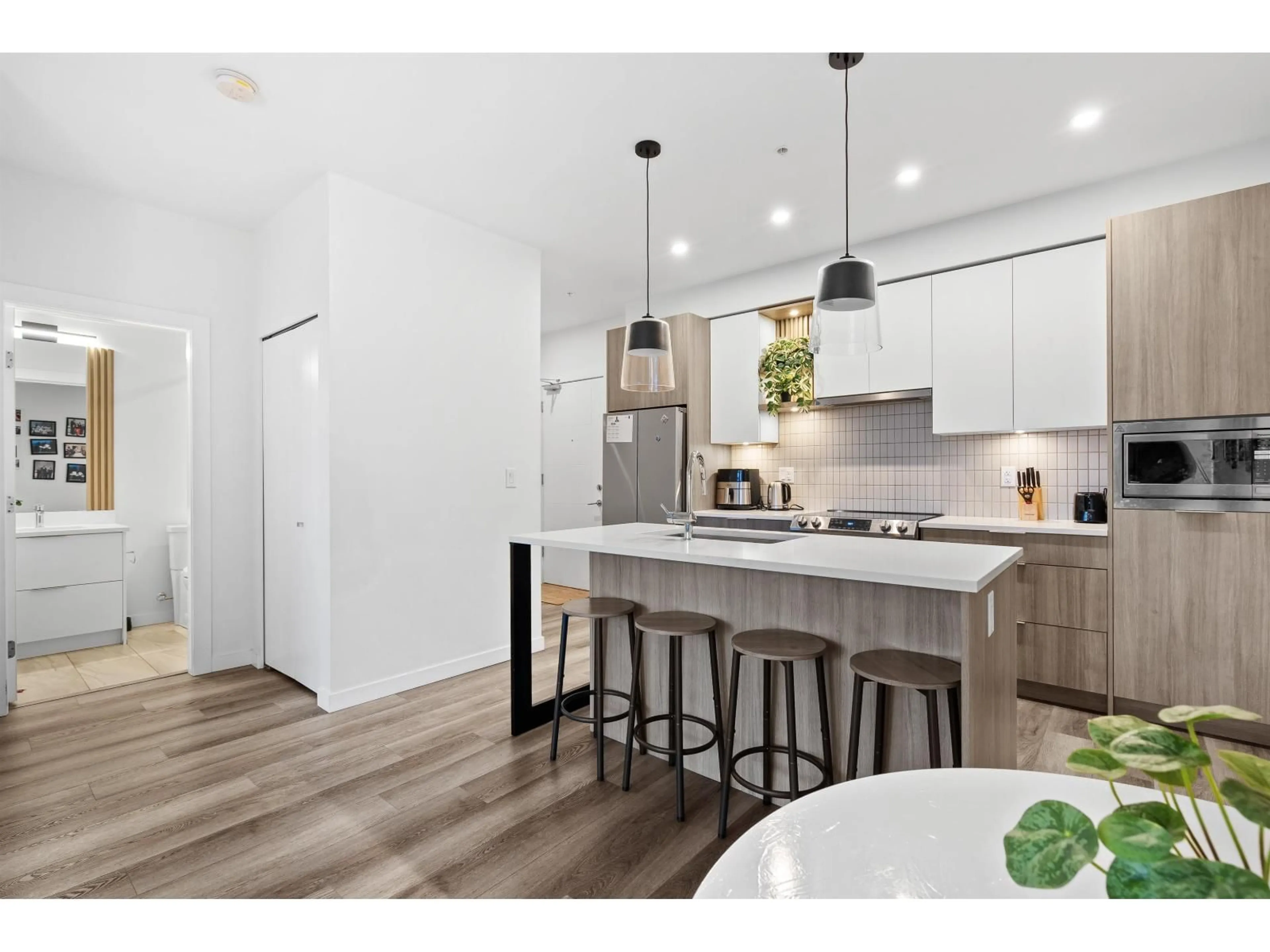 Open concept kitchen, wood/laminate floor for 217 - 20695 EASTLEIGH CRESCENT, Langley British Columbia V3A0P7