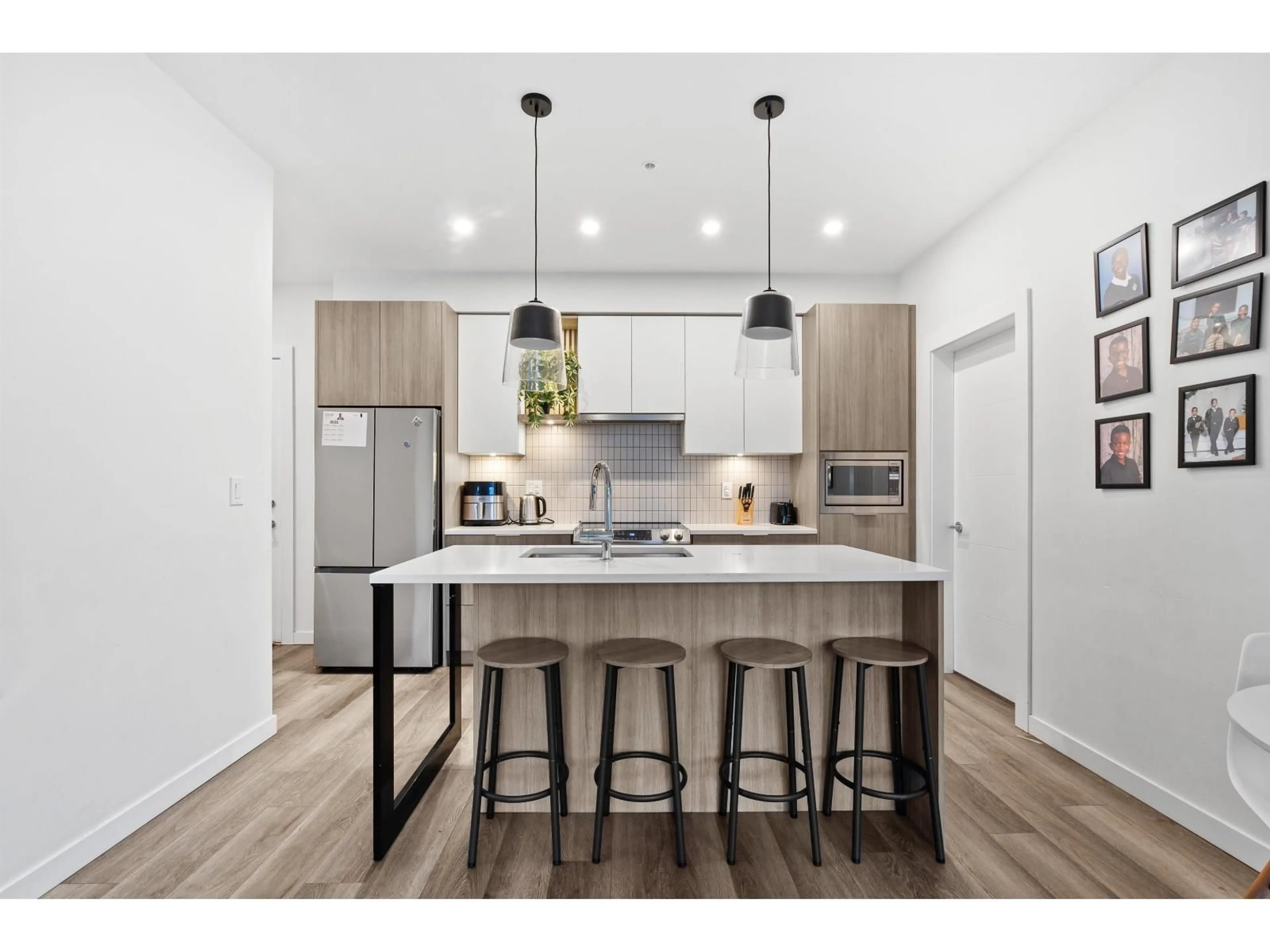 Open concept kitchen, wood/laminate floor for 217 - 20695 EASTLEIGH CRESCENT, Langley British Columbia V3A0P7