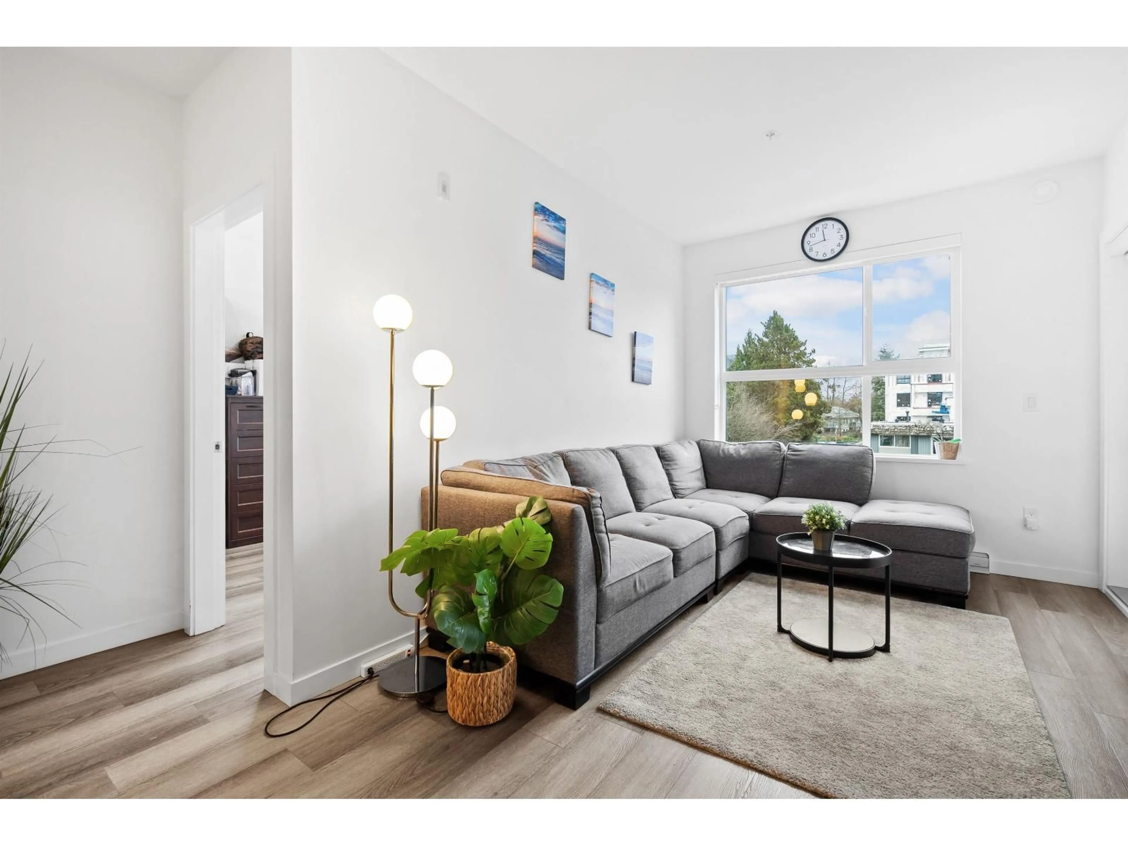 Living room with furniture, wood/laminate floor for 217 - 20695 EASTLEIGH CRESCENT, Langley British Columbia V3A0P7