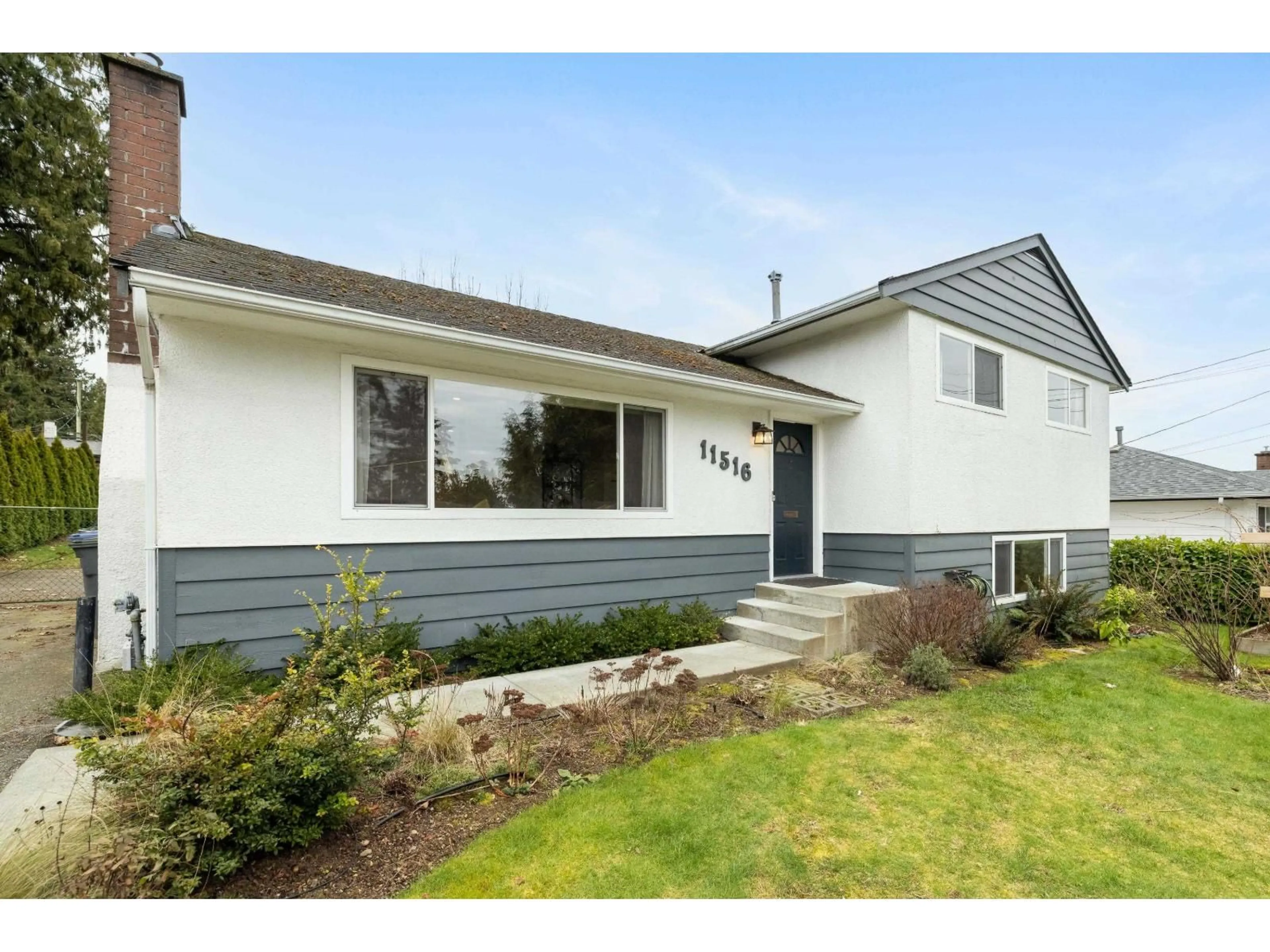 Home with vinyl exterior material, street for 11516 97 AVENUE, Surrey British Columbia V3V2B6