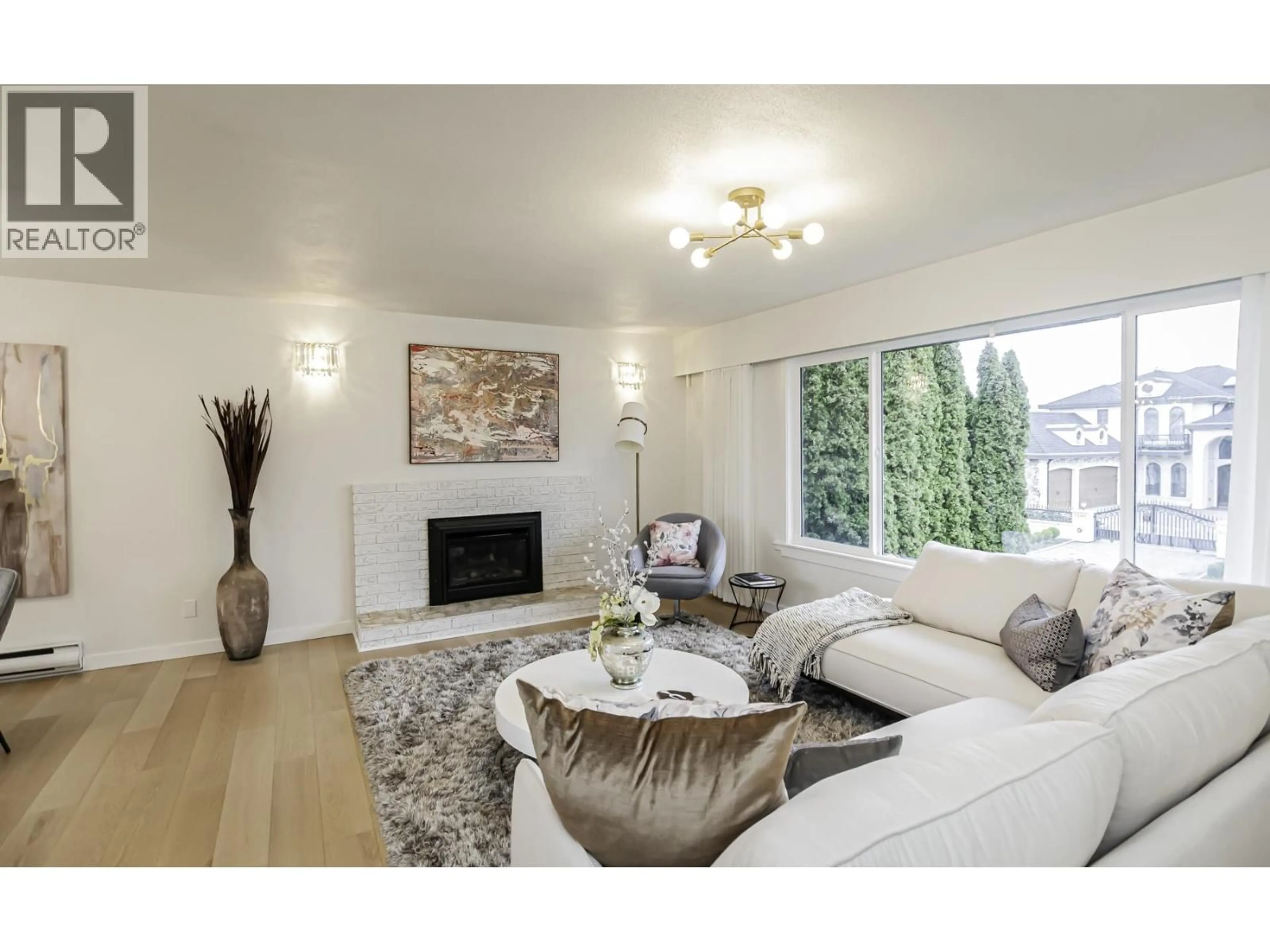 Living room with furniture, wood/laminate floor for 7111 CAVELIER COURT, Richmond British Columbia V7C4J7