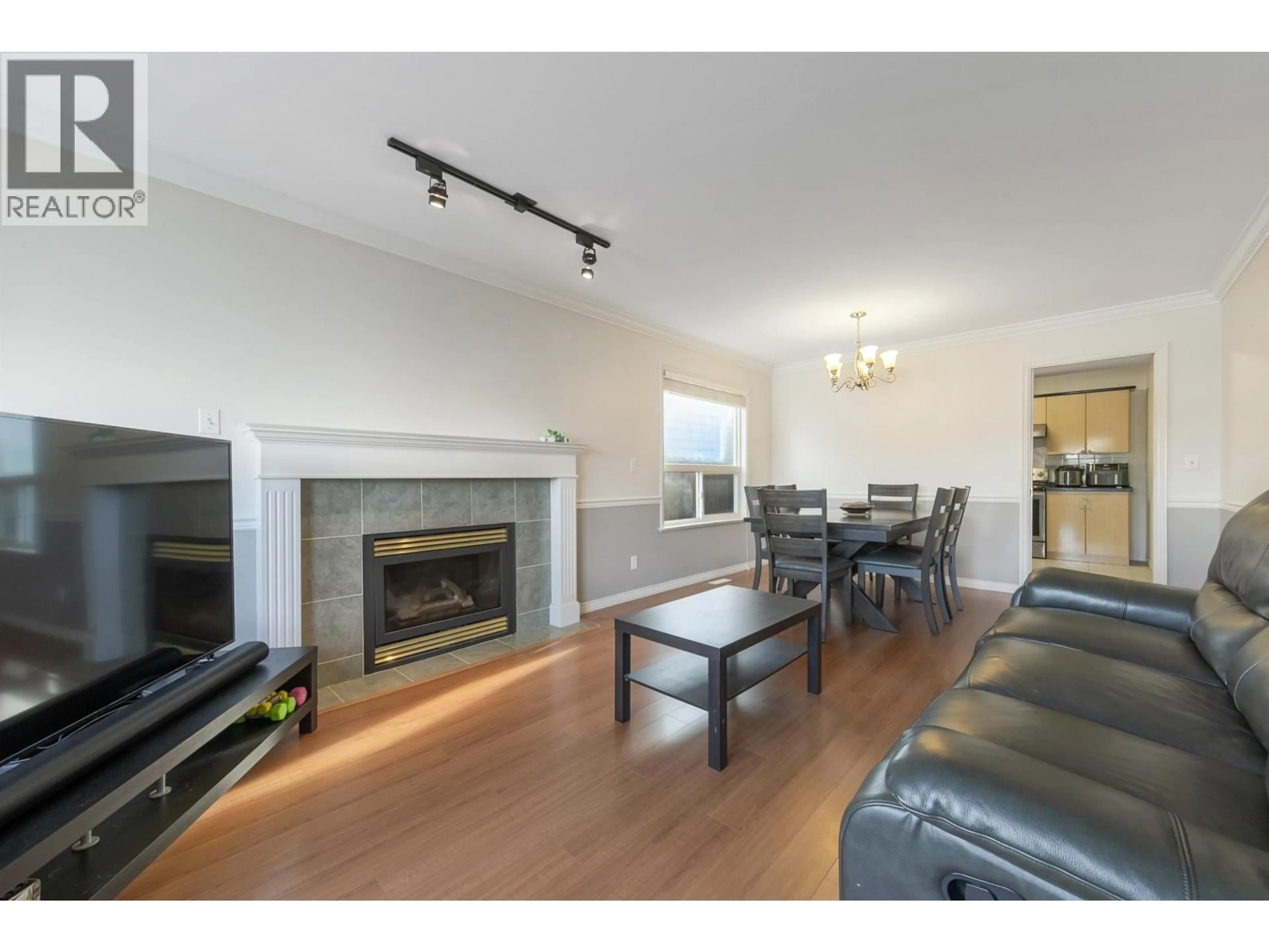 Living room with furniture, wood/laminate floor for 5056 MANOR STREET, Burnaby British Columbia V5G1B5