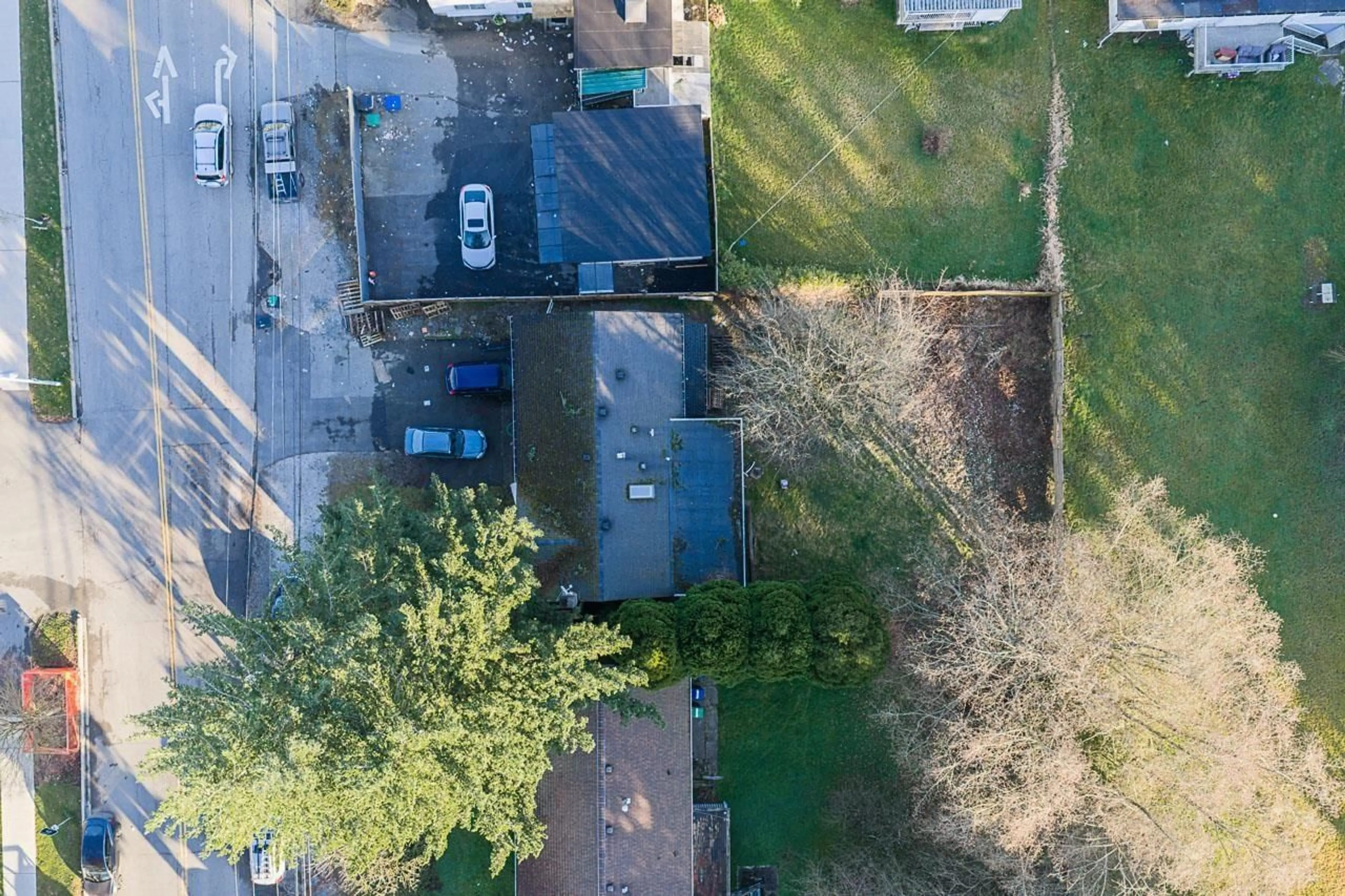 A pic from outside/outdoor area/front of a property/back of a property/a pic from drone, street for 12788 102 AVENUE, Surrey British Columbia V3V3E5