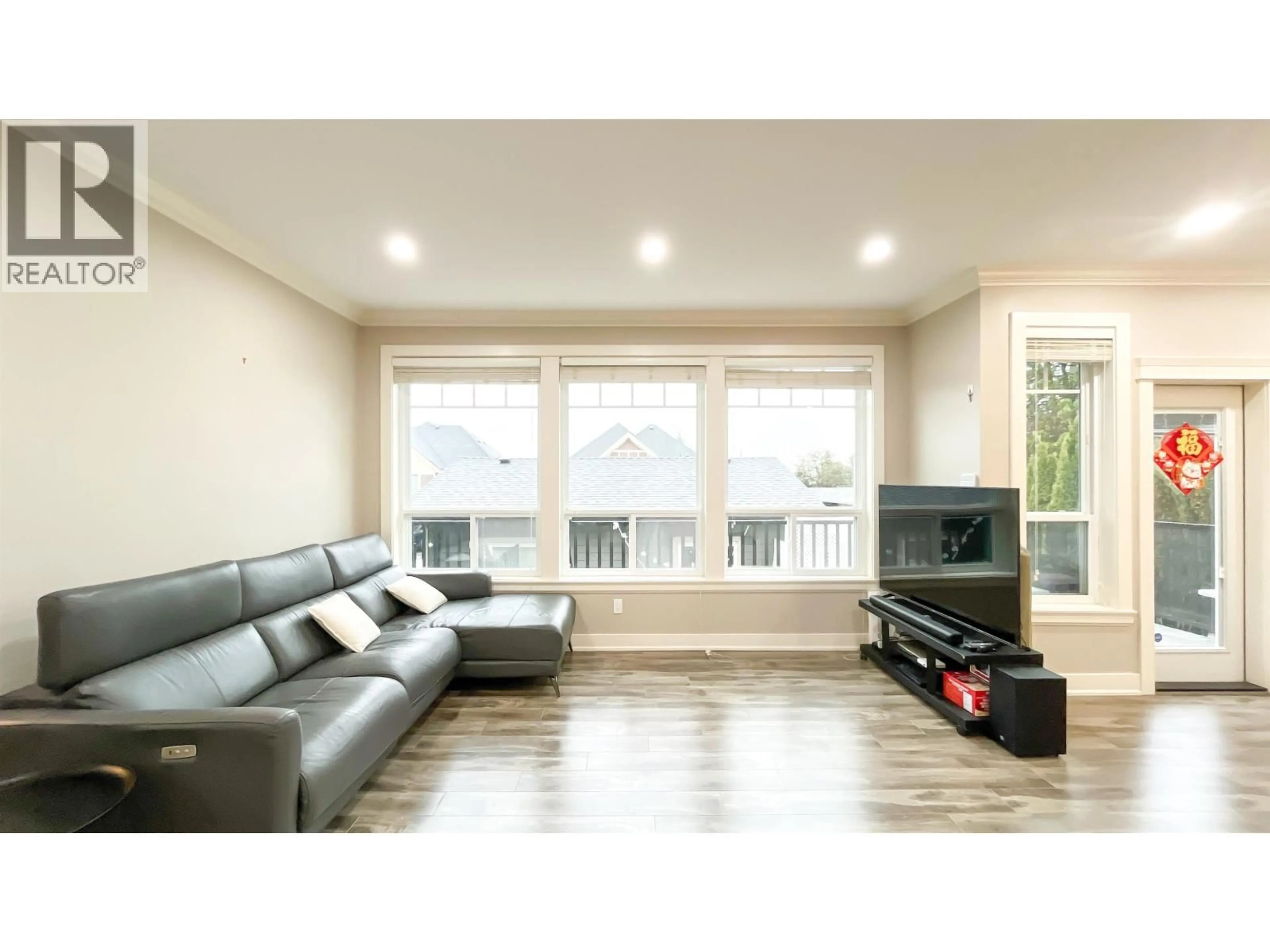 Living room with furniture, wood/laminate floor for 101 - 910 DELESTRE AVENUE, Coquitlam British Columbia V3K2G6