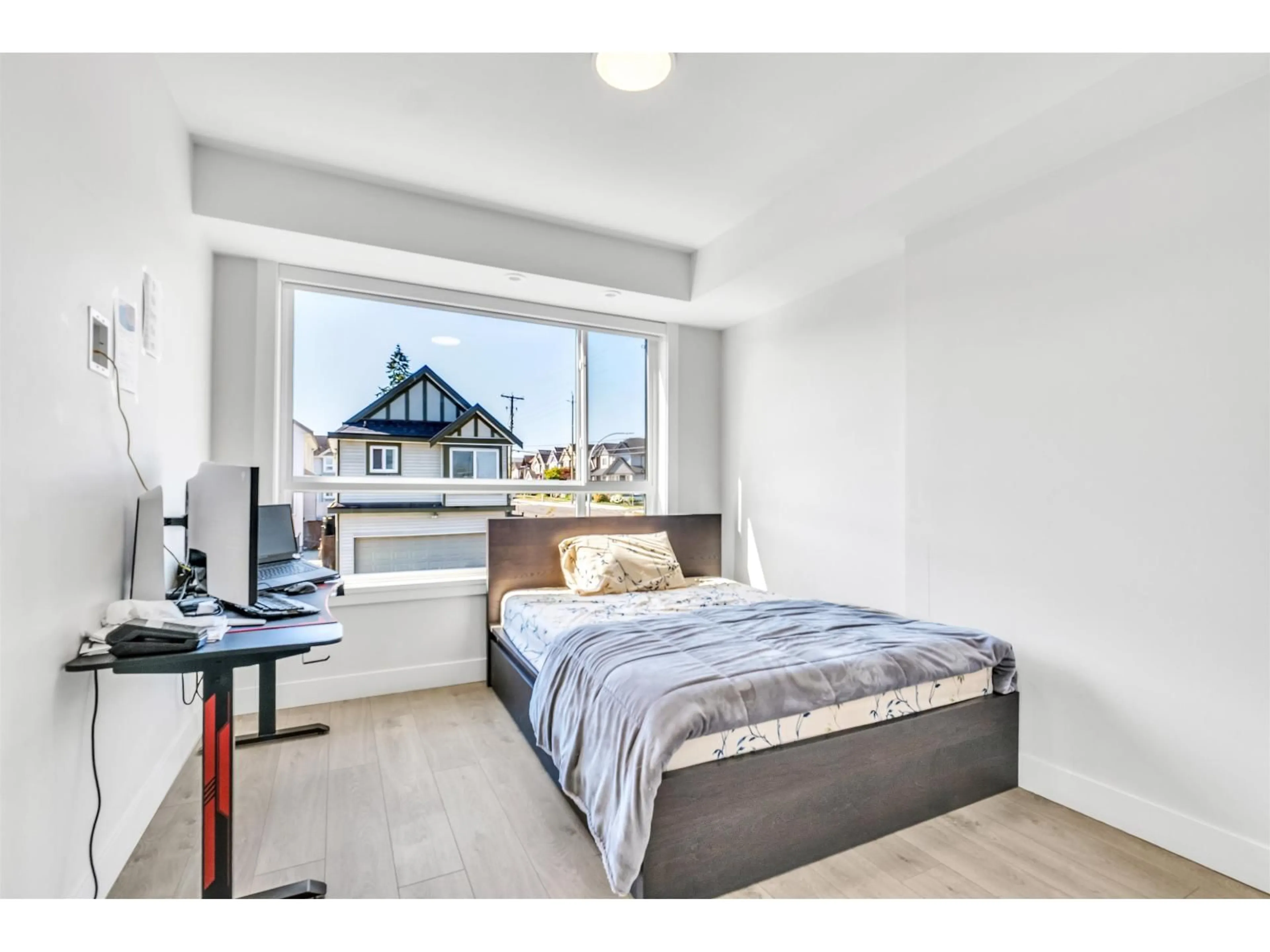 Bedroom with bed, wood/laminate floor for 212 - 14818 60 AVENUE, Surrey British Columbia V3S0B5