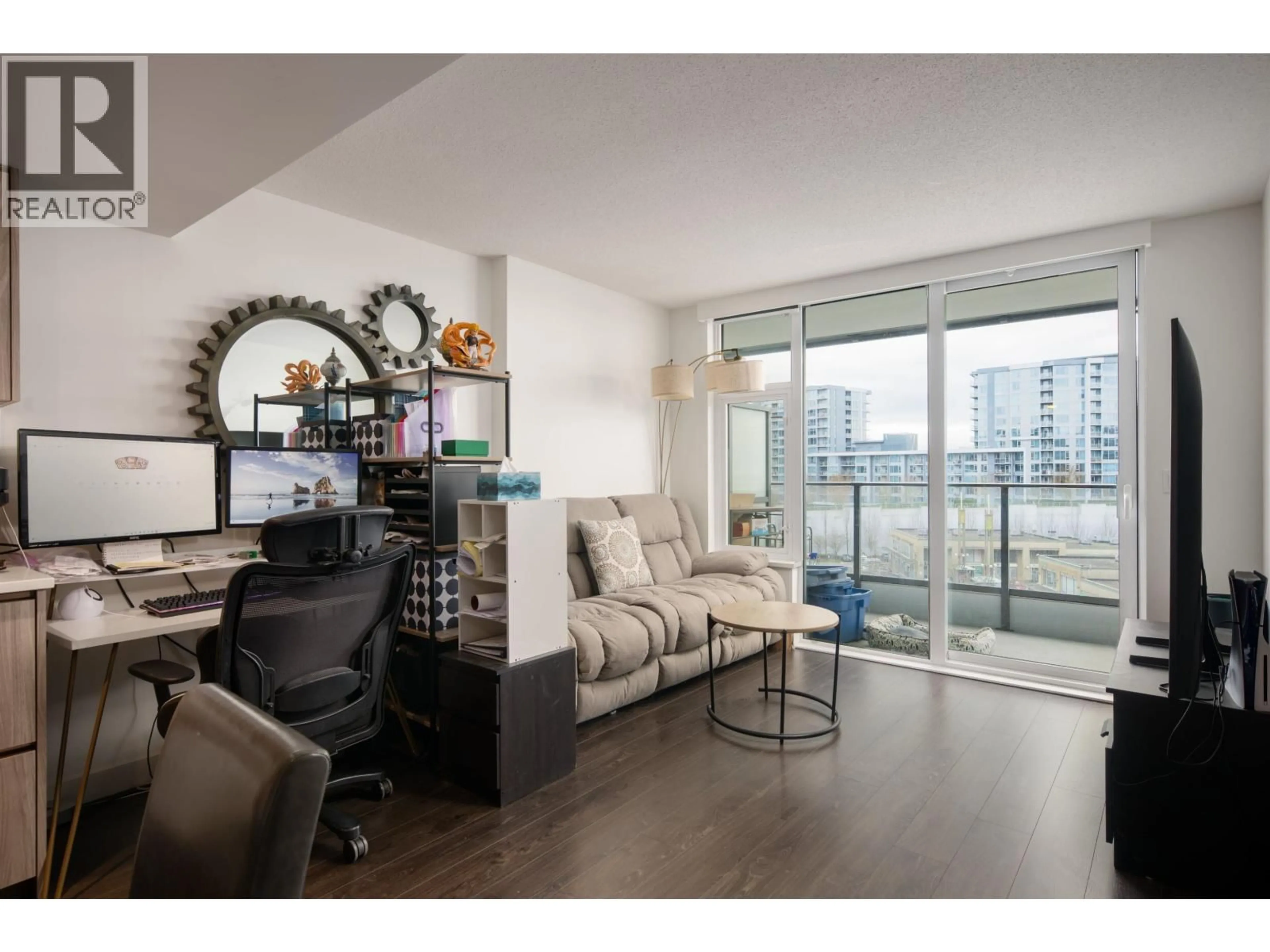 Living room with furniture, wood/laminate floor for 605 - 8555 CAPSTAN WAY, Richmond British Columbia V6X0W1
