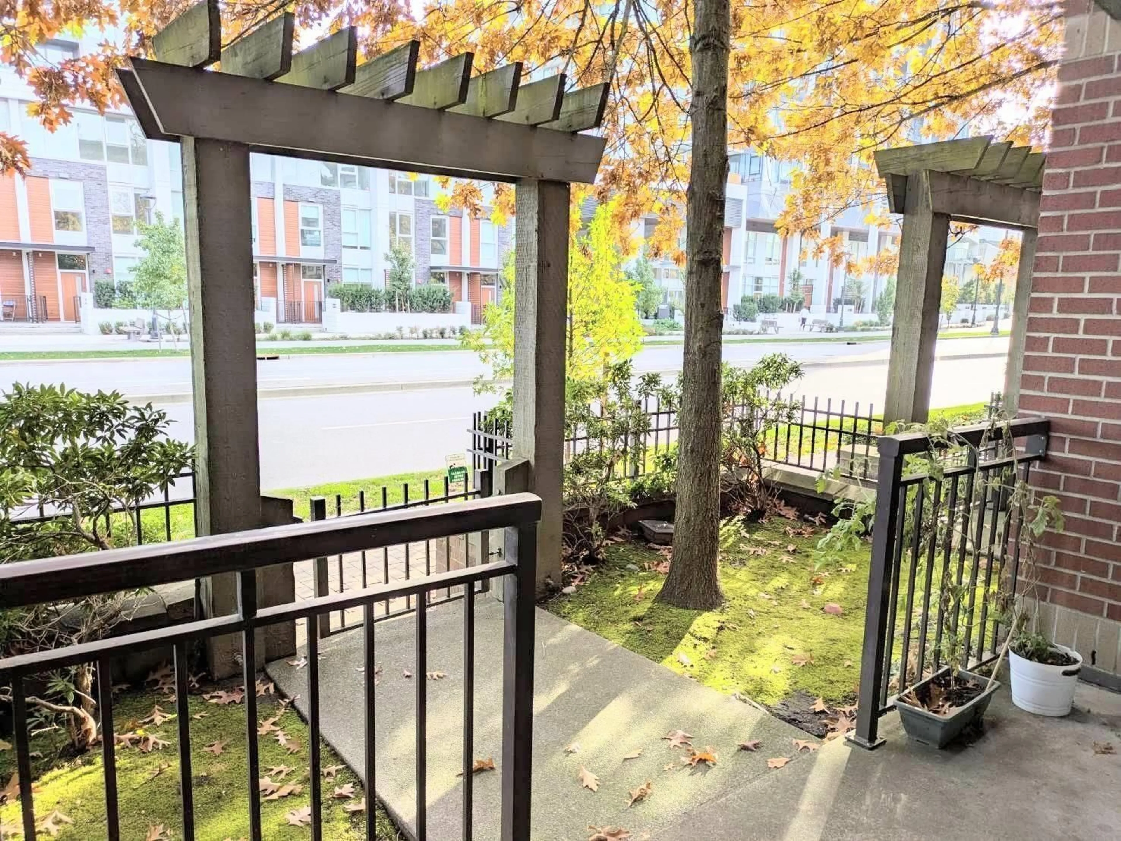 Patio, city buildings view from balcony for 106 - 10499 UNIVERSITY DRIVE, Surrey British Columbia V3T0A4