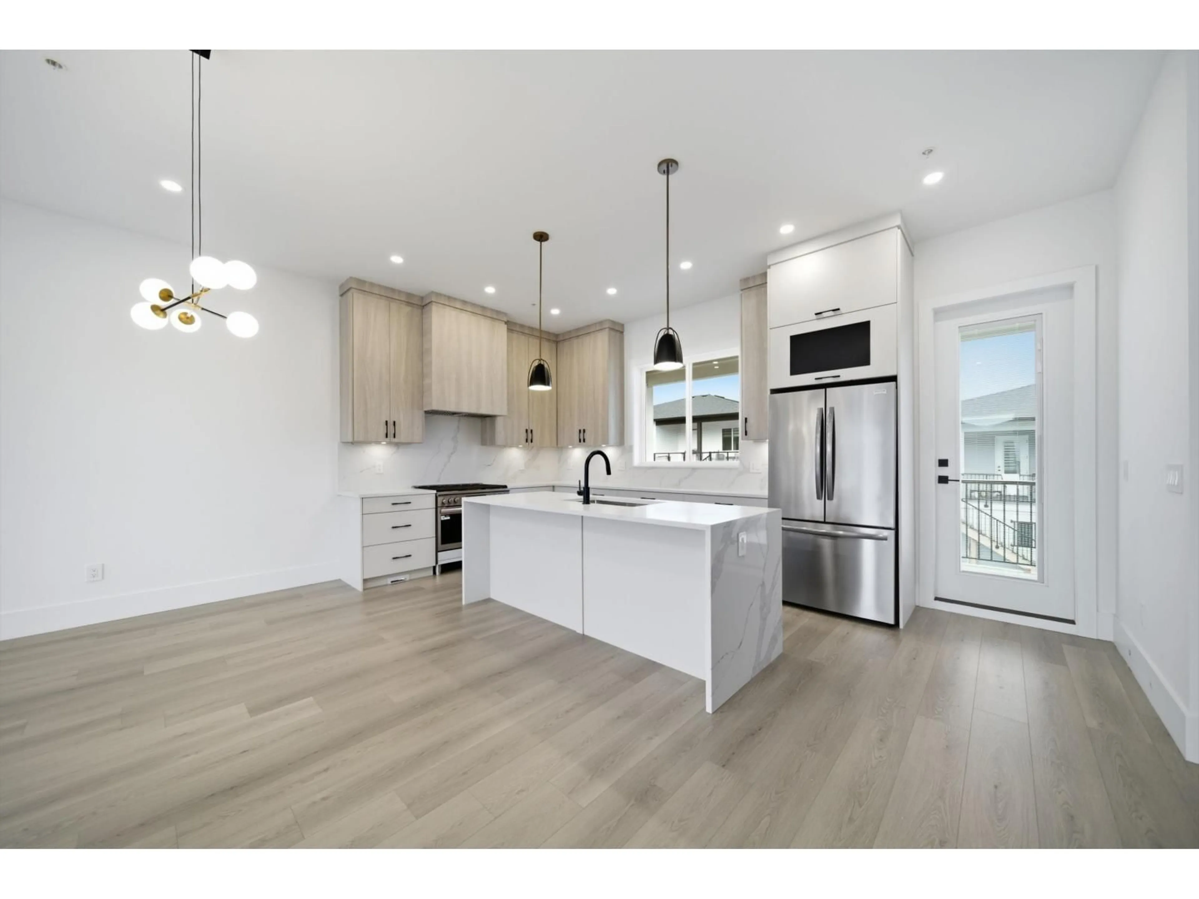 Open concept kitchen, wood/laminate floor for 32738 CARTER AVENUE, Mission British Columbia V2V3A2