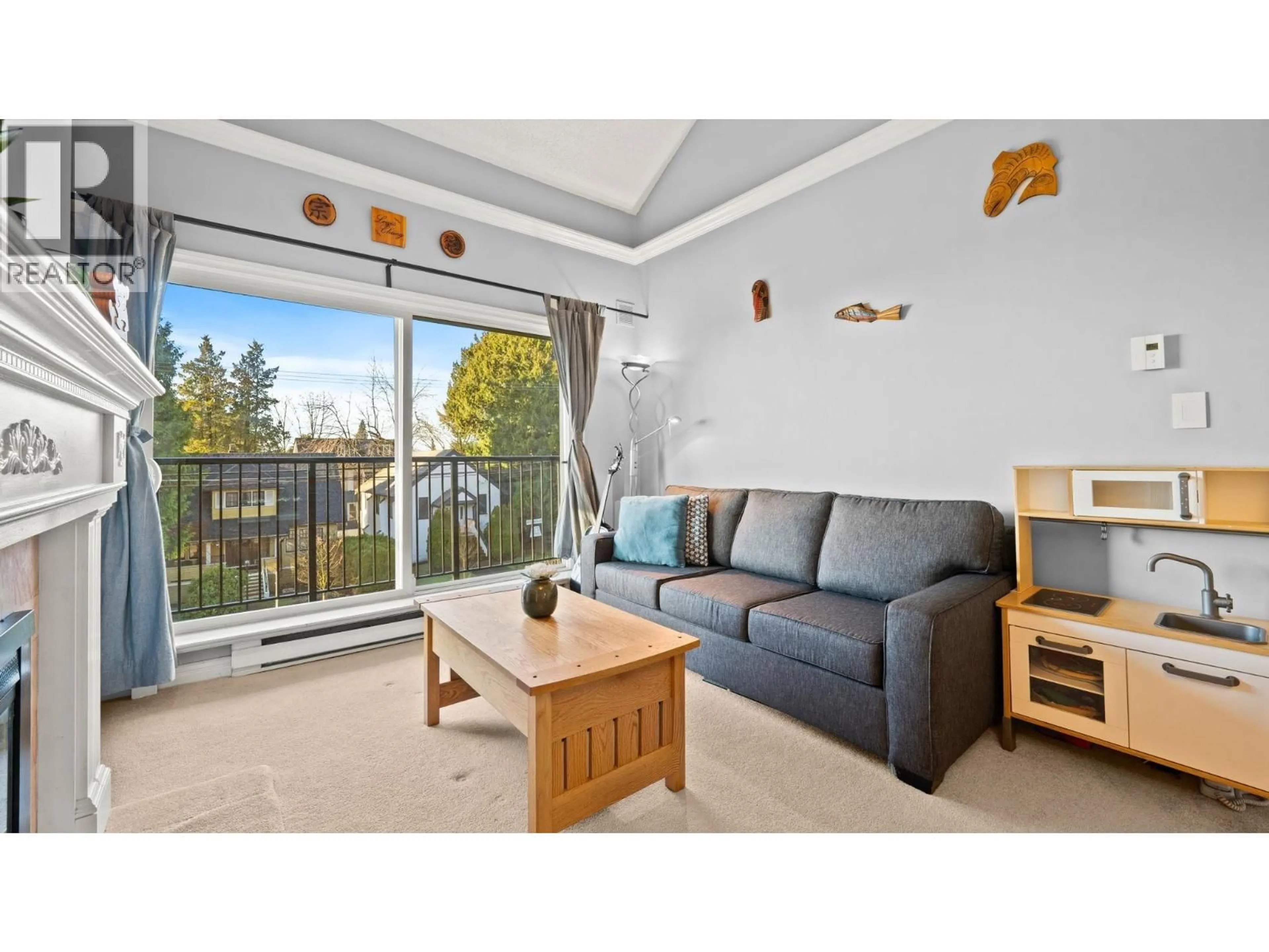 Living room with furniture, wood/laminate floor for 302 - 620 BLACKFORD STREET, New Westminster British Columbia V3M1R6