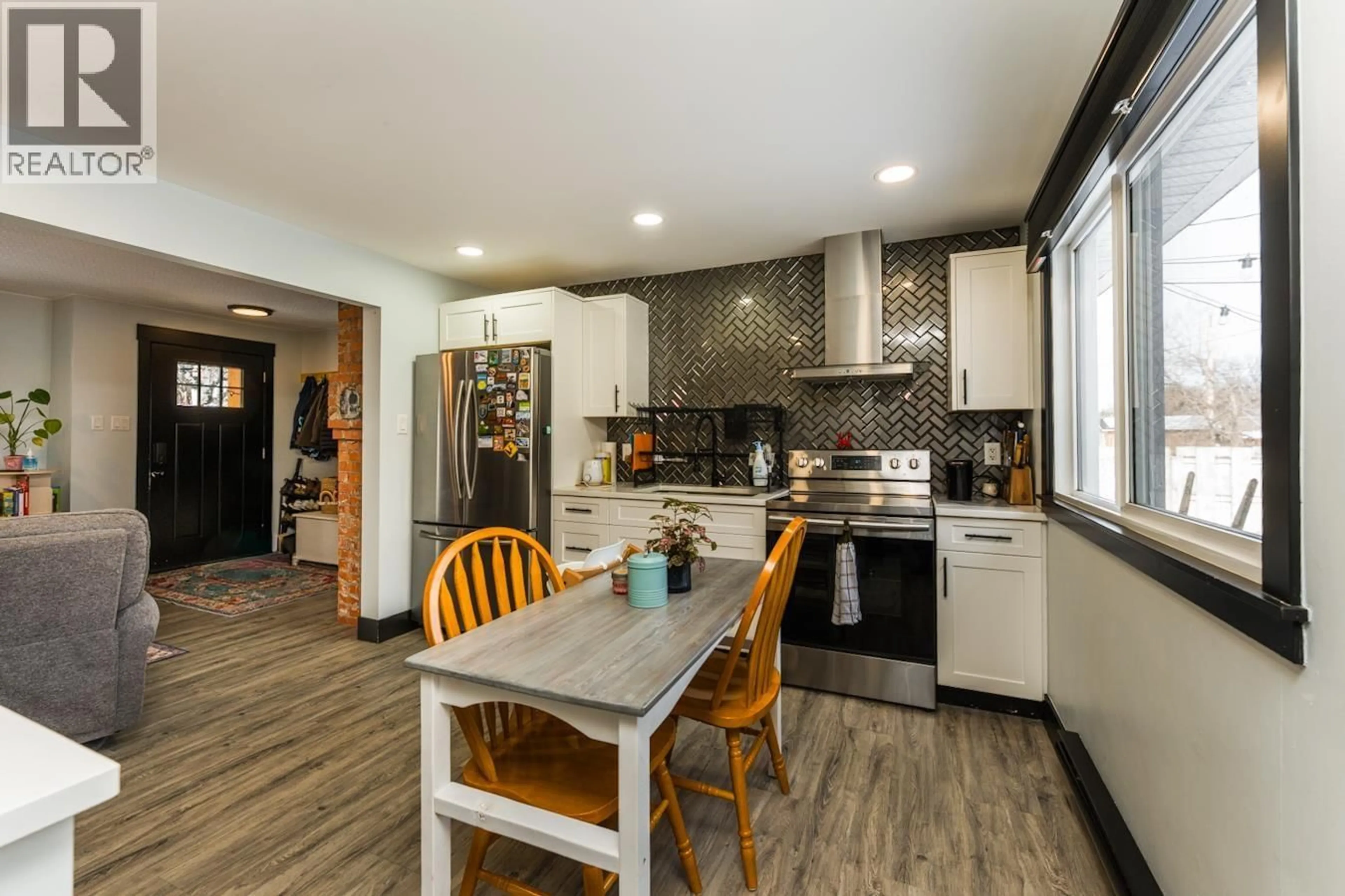 Open concept kitchen, wood/laminate floor for 1610 ELM STREET, Prince George British Columbia V2L1C8