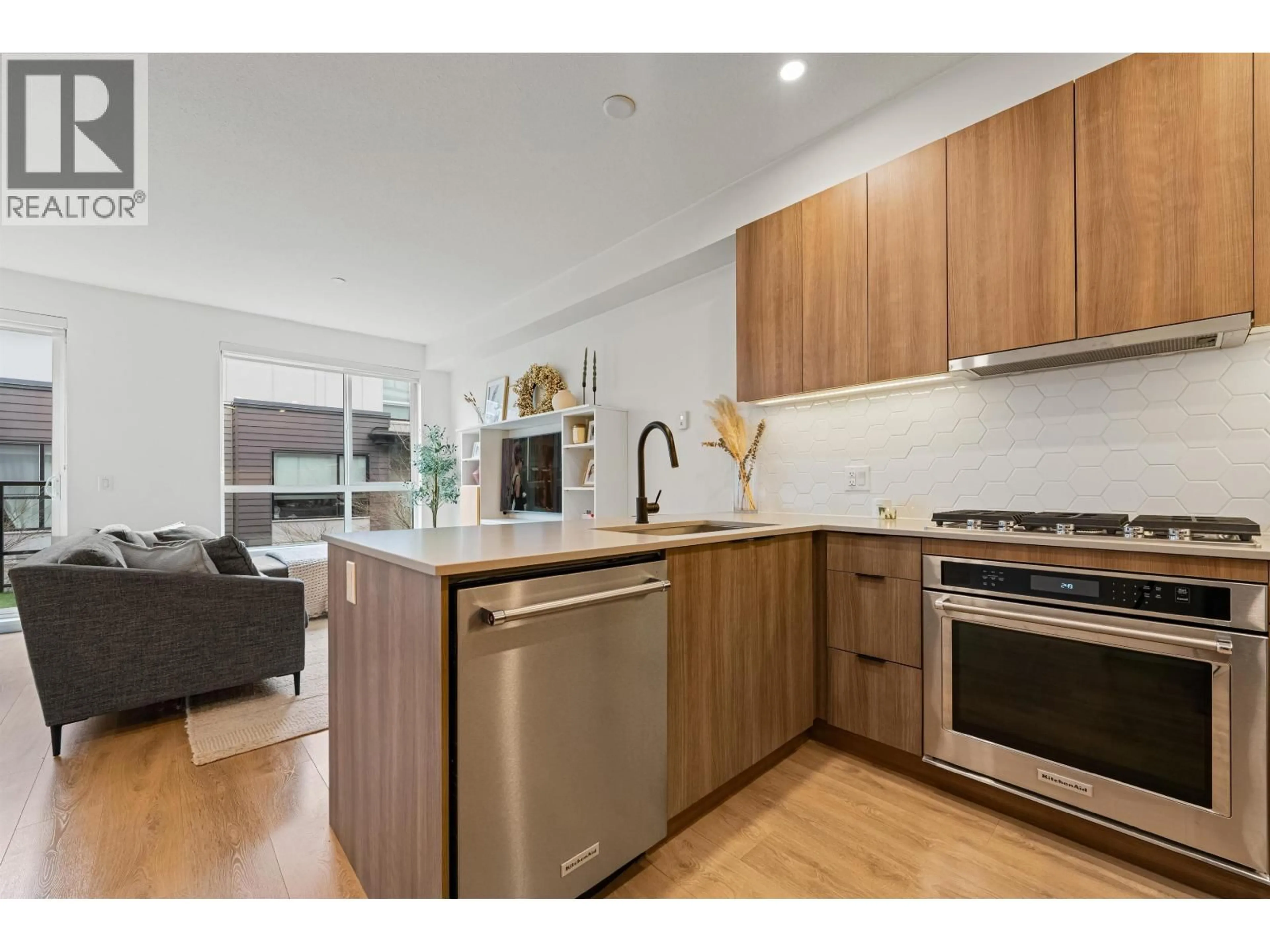 Open concept kitchen, wood/laminate floor for 7 - 533 3RD STREET, North Vancouver British Columbia V7L1G4