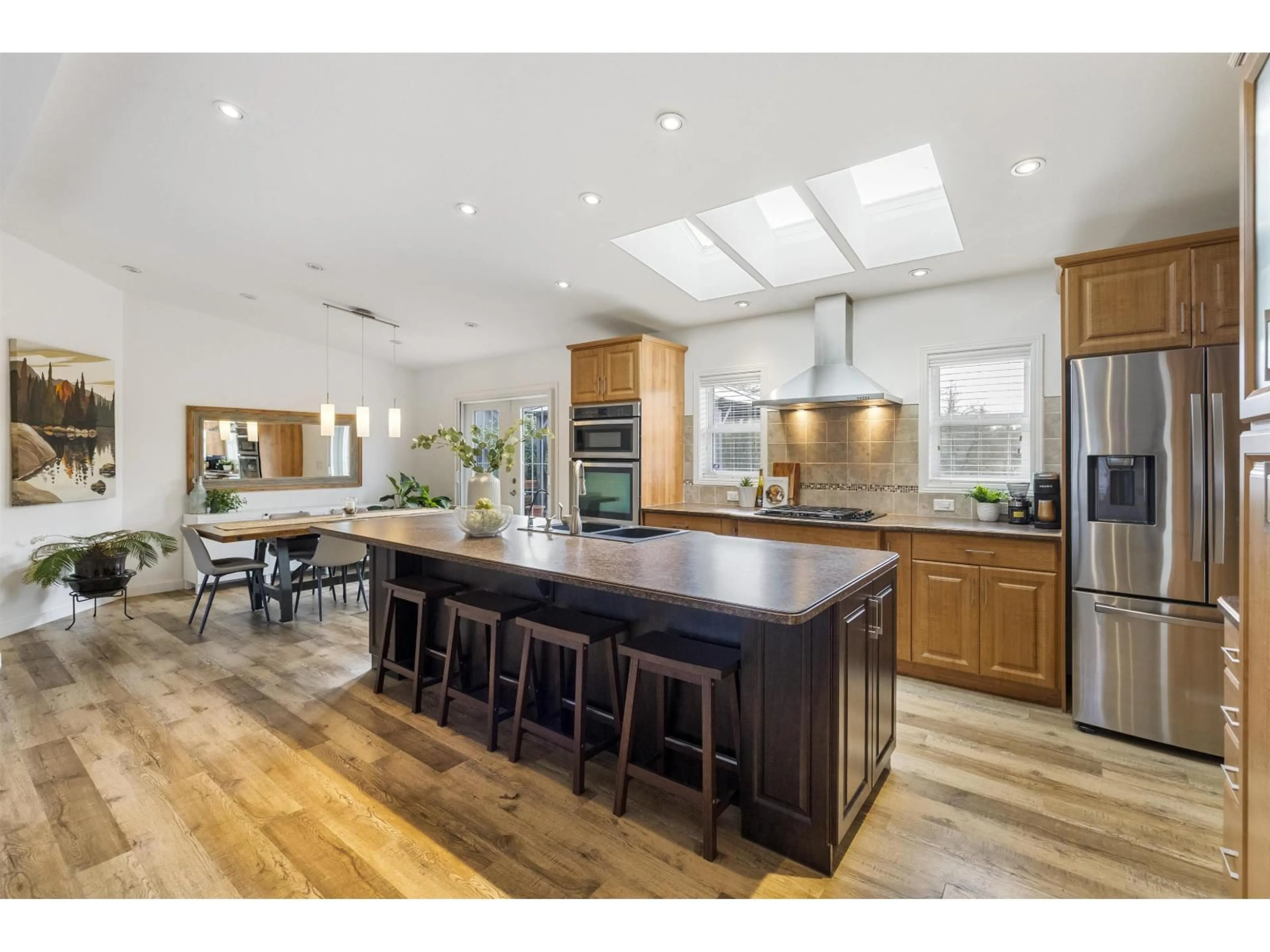 Open concept kitchen, wood/laminate floor for 23544 20 AVENUE, Langley British Columbia V2Z2Z7