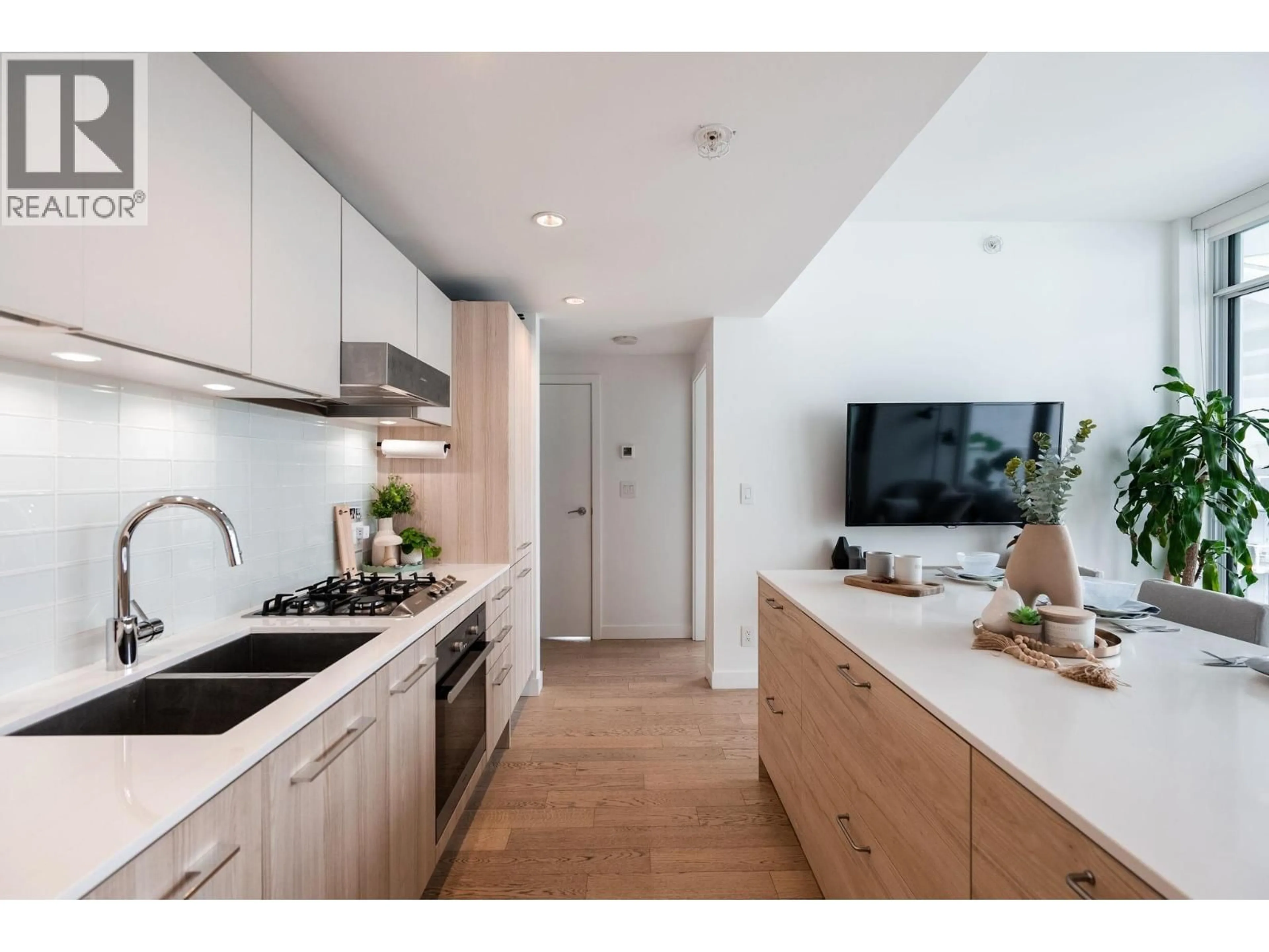 Open concept kitchen, wood/laminate floor for 1801 - 4638 GLADSTONE STREET, Vancouver British Columbia V5N0G5