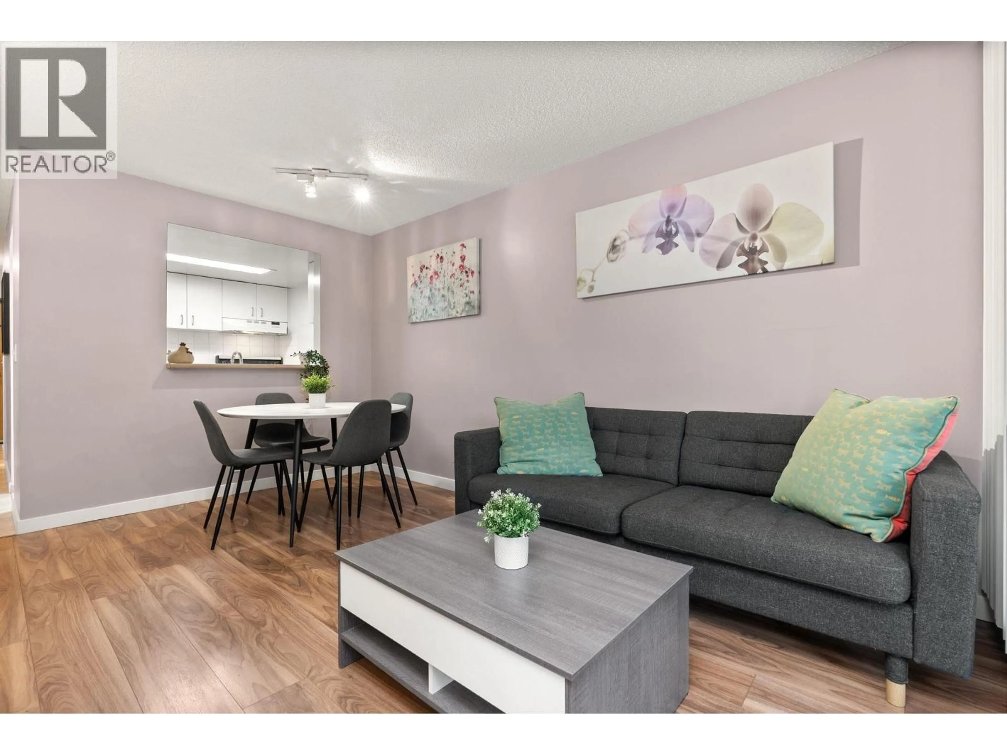 Living room with furniture, wood/laminate floor for 504 - 789 DRAKE STREET, Vancouver British Columbia V6Z2N7