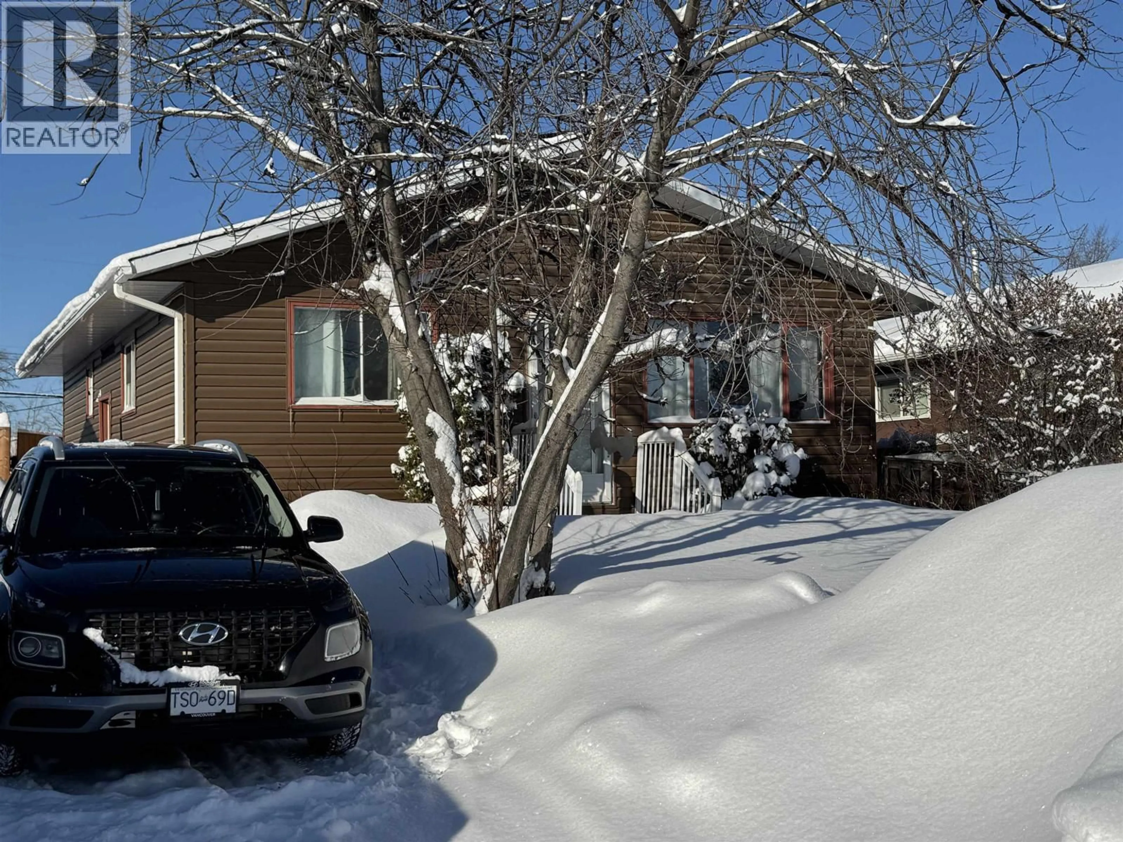 A pic from outside/outdoor area/front of a property/back of a property/a pic from drone, street for 9020 91 STREET, Fort St. John British Columbia V1J4R6