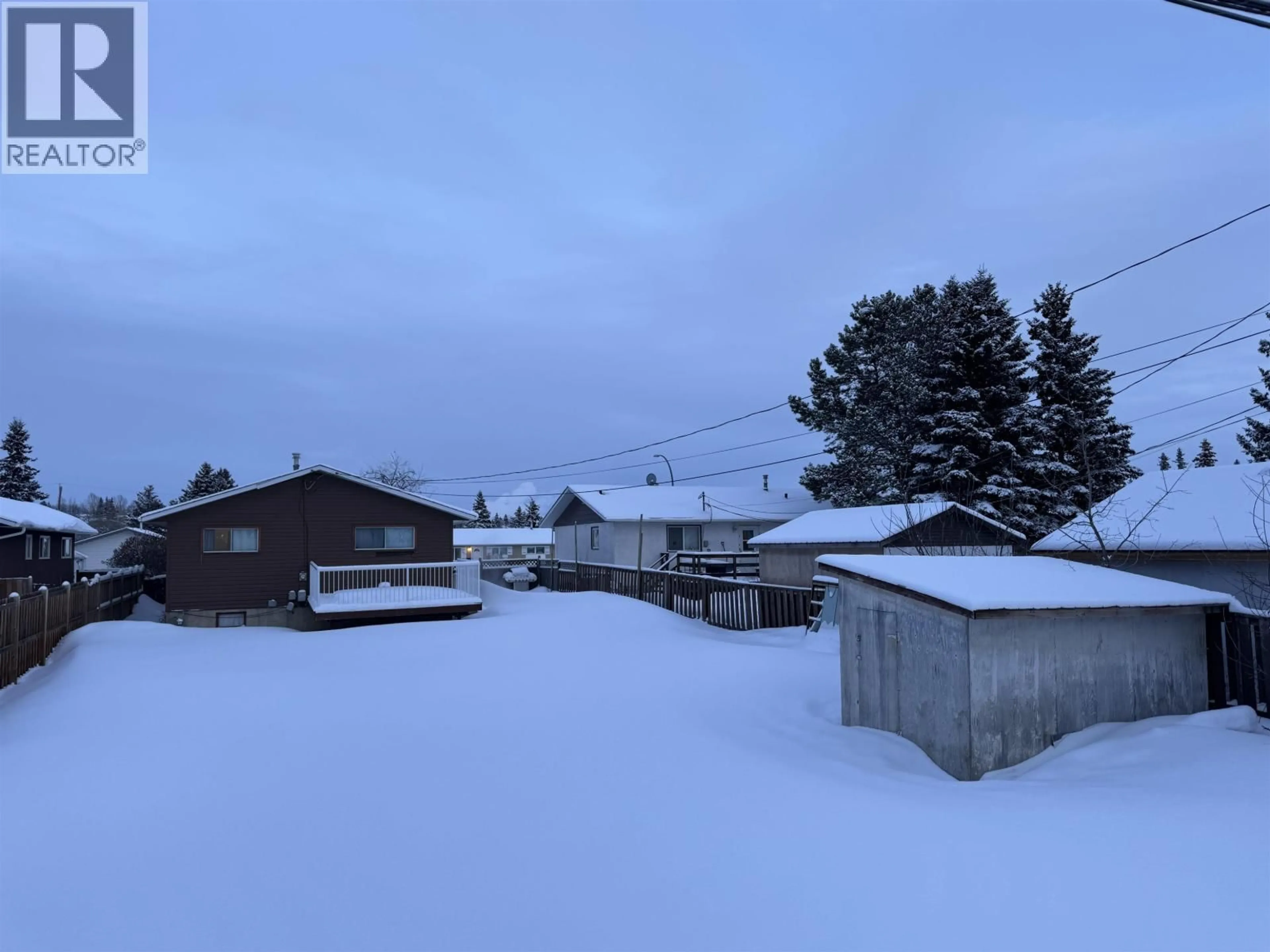 A pic from outside/outdoor area/front of a property/back of a property/a pic from drone, mountain view for 9020 91 STREET, Fort St. John British Columbia V1J4R6