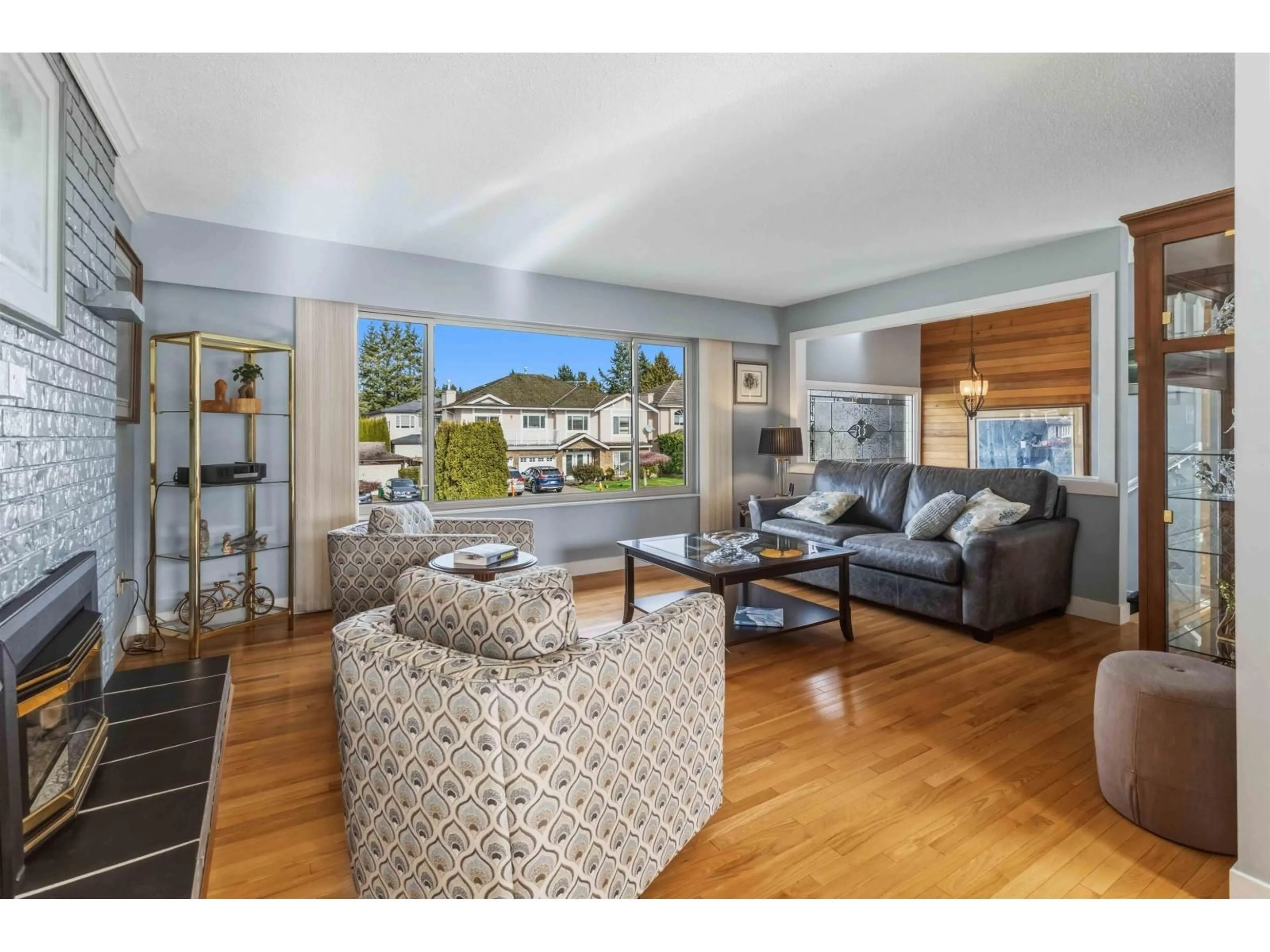 Living room with furniture, wood/laminate floor for 11078 83A AVENUE, Delta British Columbia V4C2J5