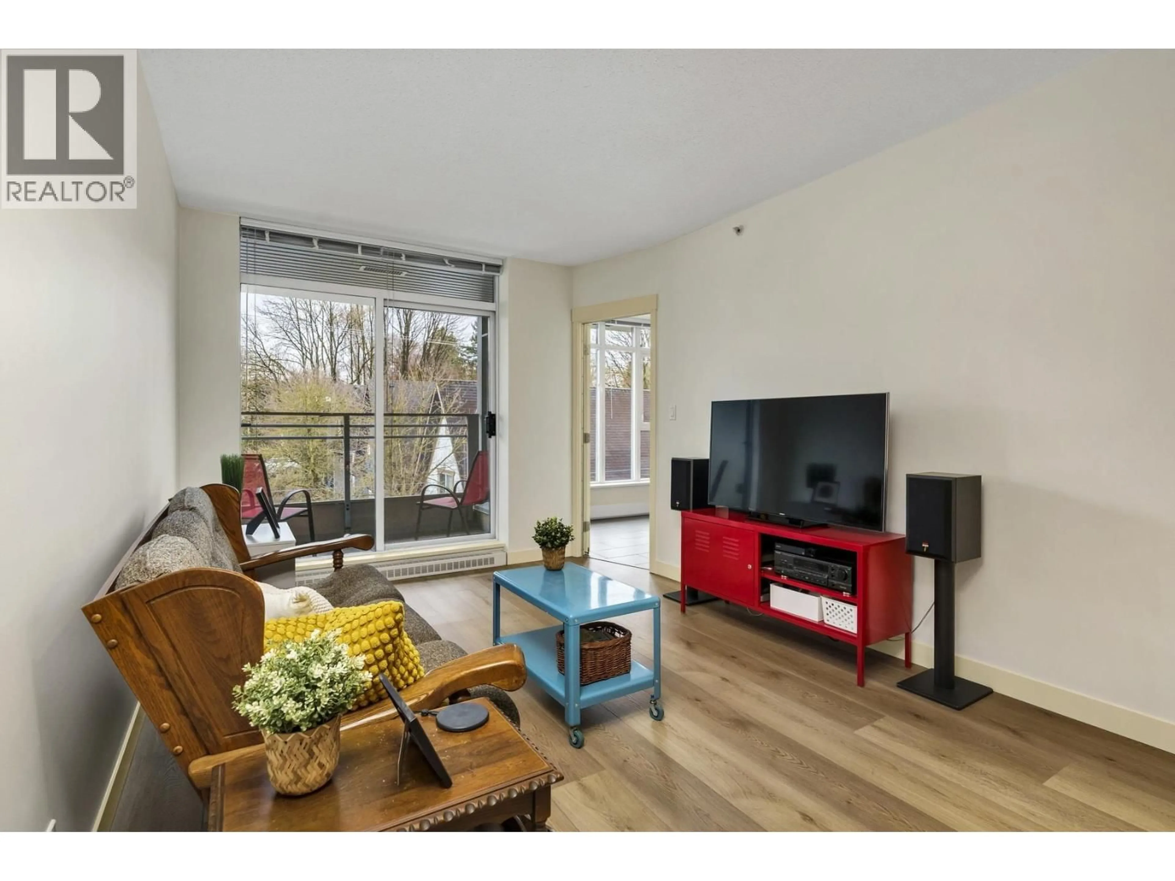 Living room with furniture, wood/laminate floor for 413 - 2520 MANITOBA STREET, Vancouver British Columbia V5Y3A6