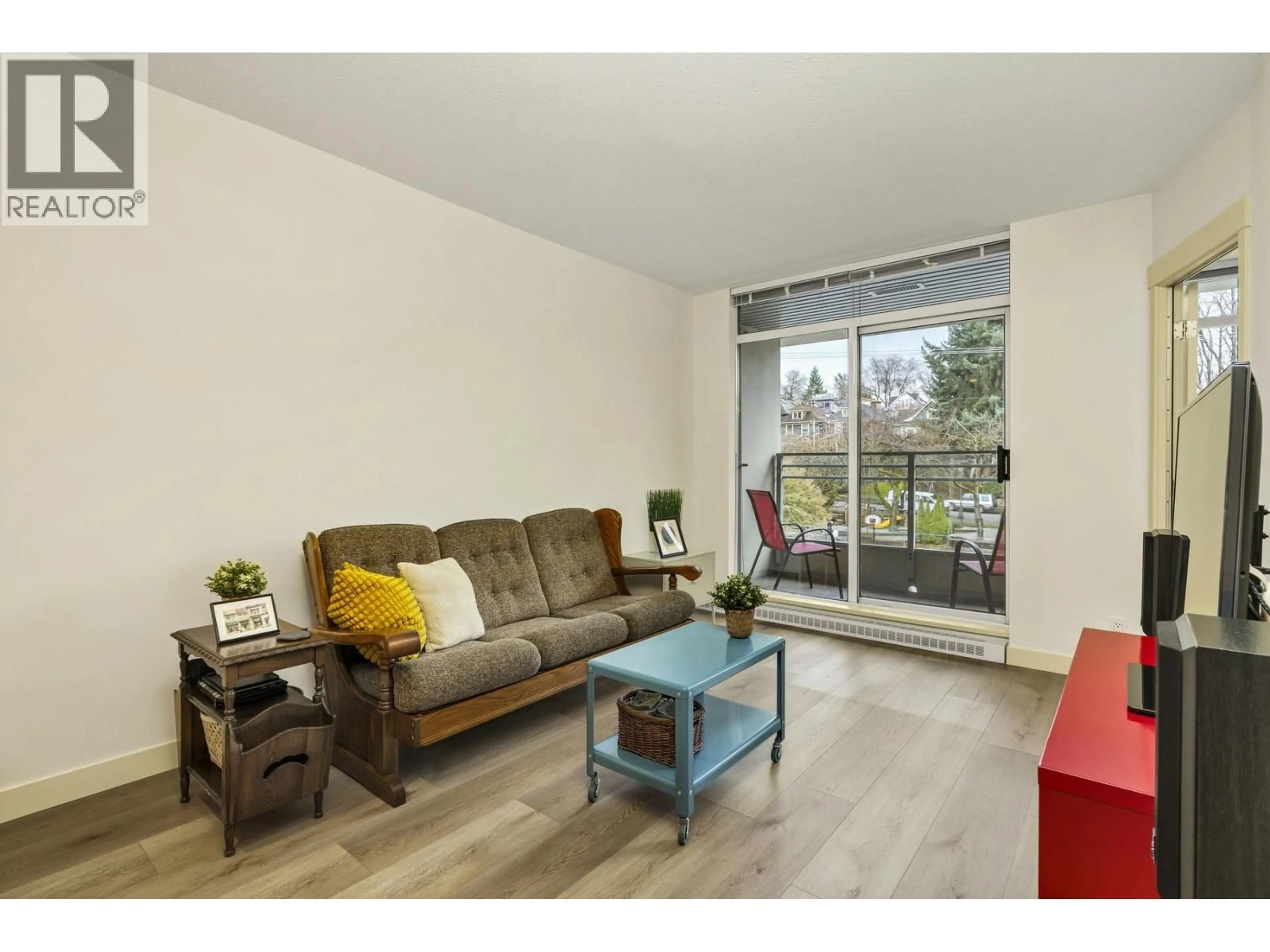 Living room with furniture, wood/laminate floor for 413 - 2520 MANITOBA STREET, Vancouver British Columbia V5Y3A6
