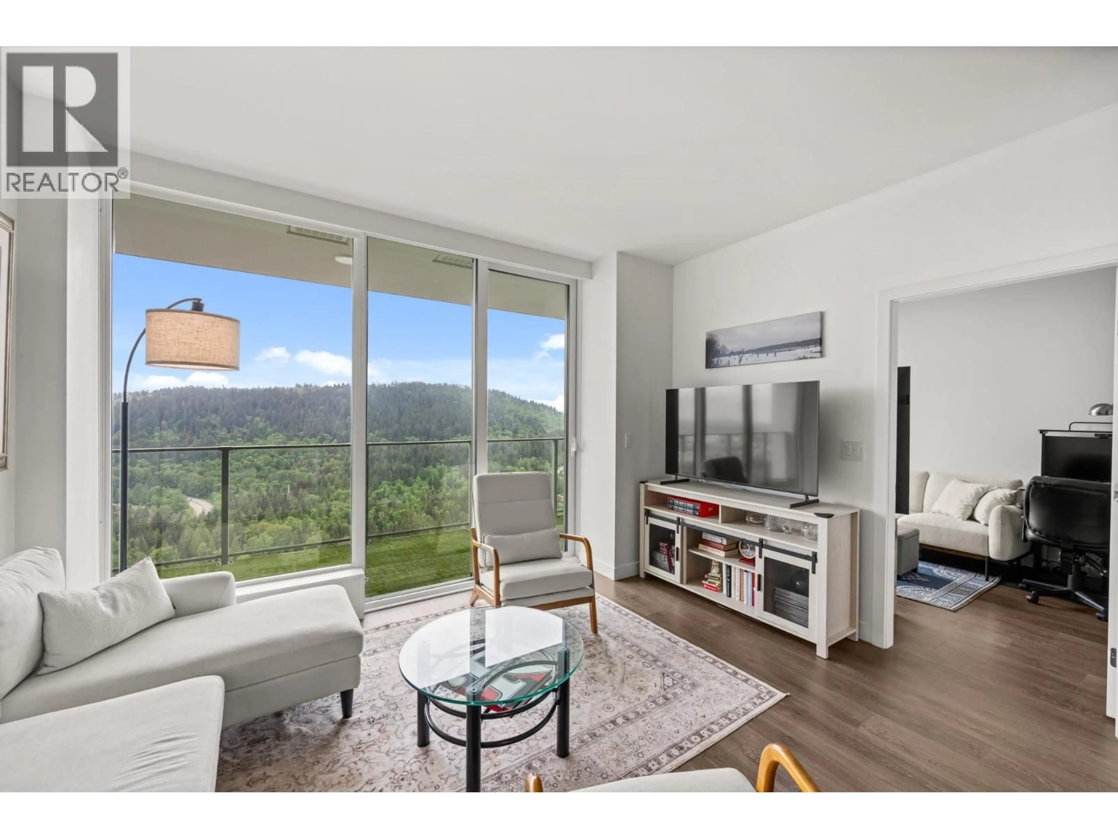 Living room with furniture, wood/laminate floor for 4102 - 567 CLARKE ROAD, Coquitlam British Columbia V3J0K7