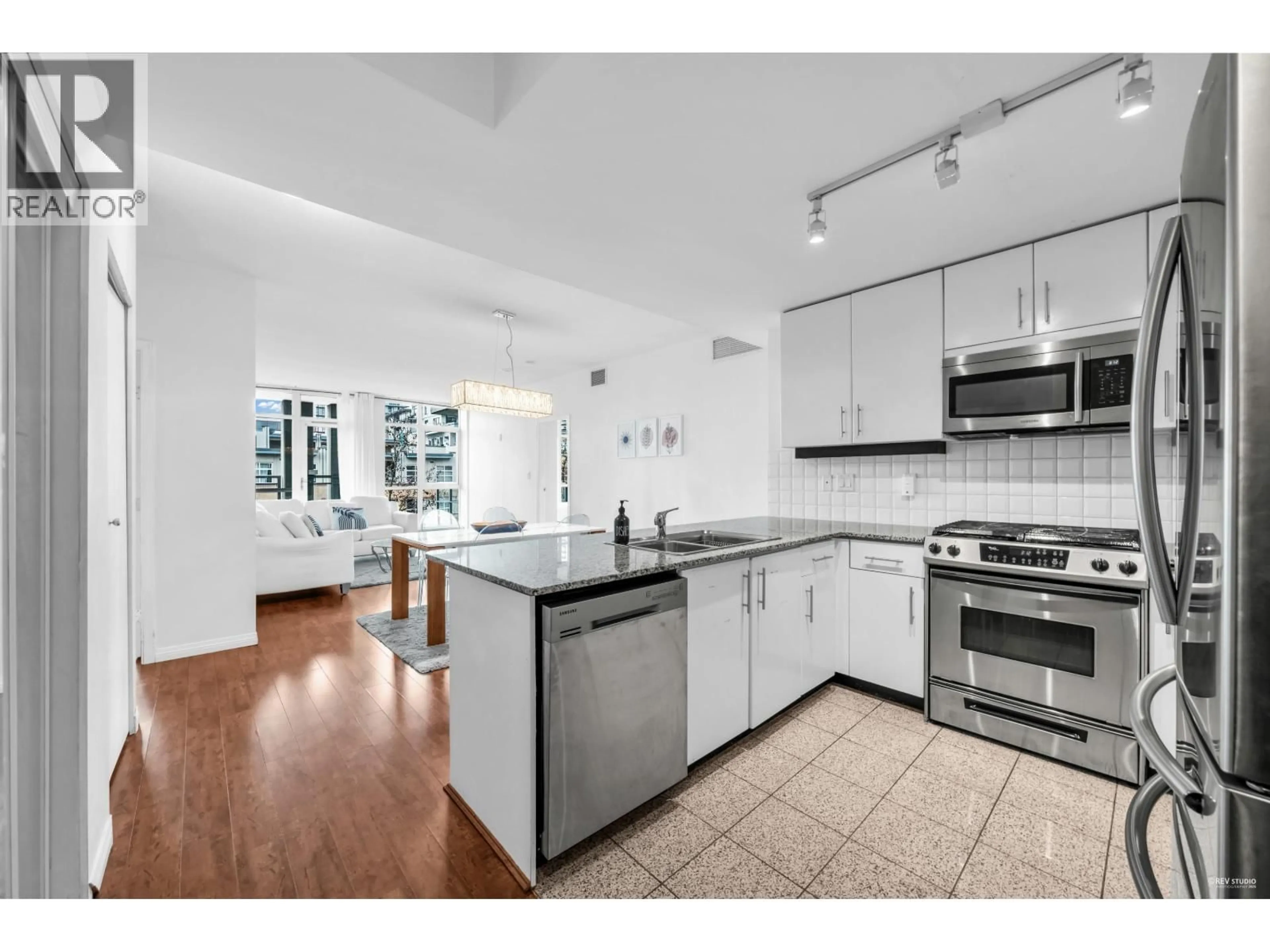 Open concept kitchen, ceramic/tile floor for 409 - 100 ESPLANADE STREET, North Vancouver British Columbia V7L4V1