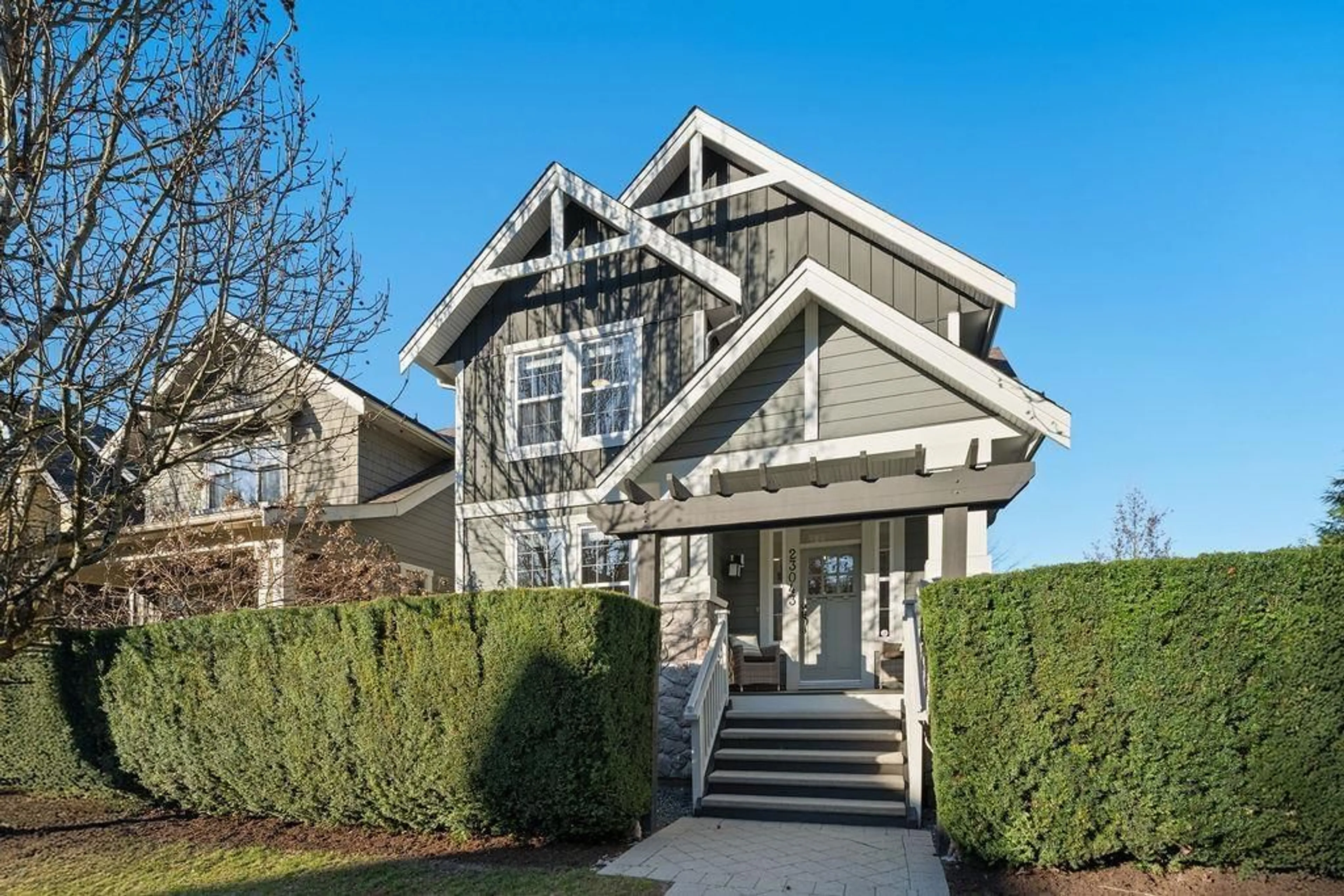 Home with vinyl exterior material, street for 23043 BILLY BROWN ROAD, Langley British Columbia V1M4G2