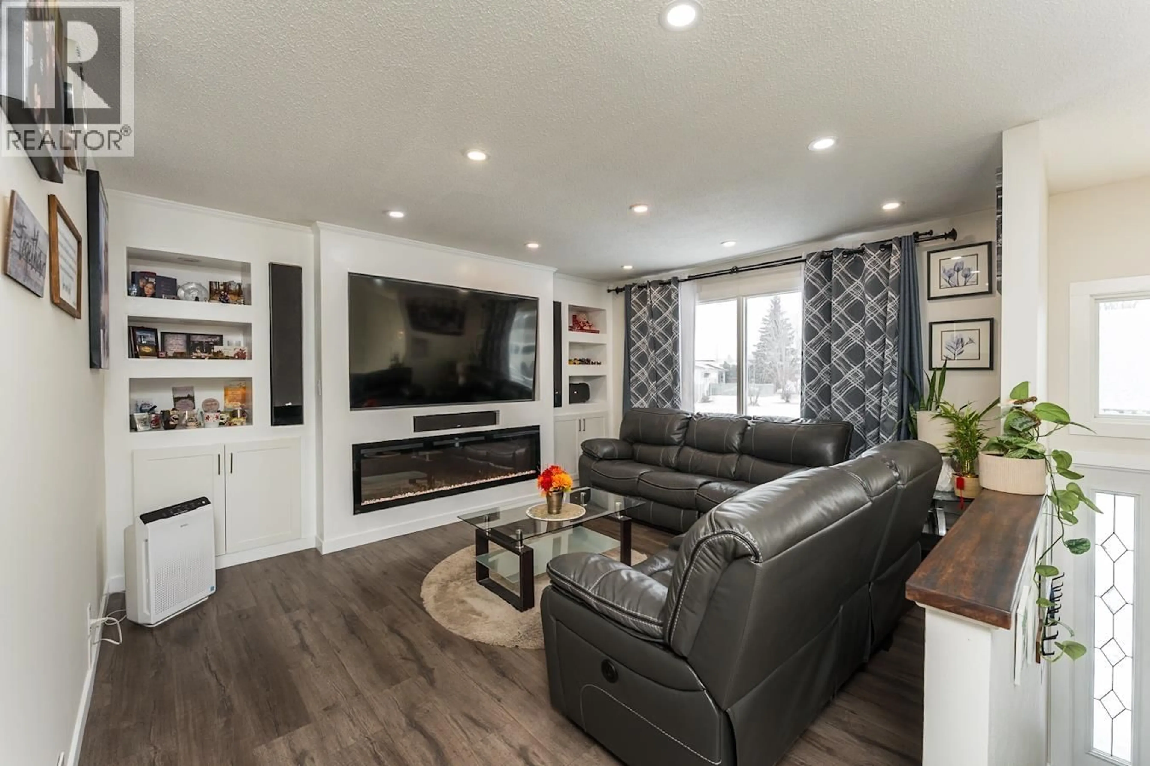 Living room with furniture, wood/laminate floor for 1795 IRWIN STREET, Prince George British Columbia V2M2Y6
