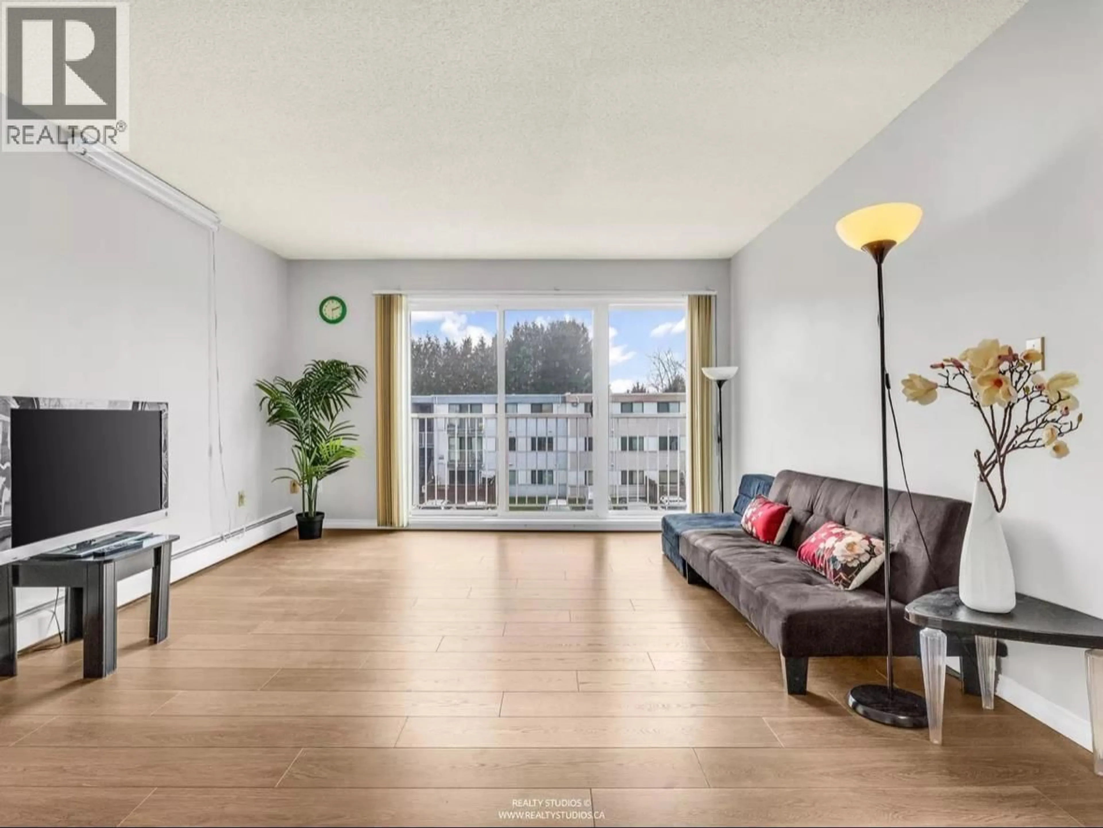 Living room with furniture, wood/laminate floor for 305 - 7260 LINDSAY ROAD, Richmond British Columbia V7C3M6