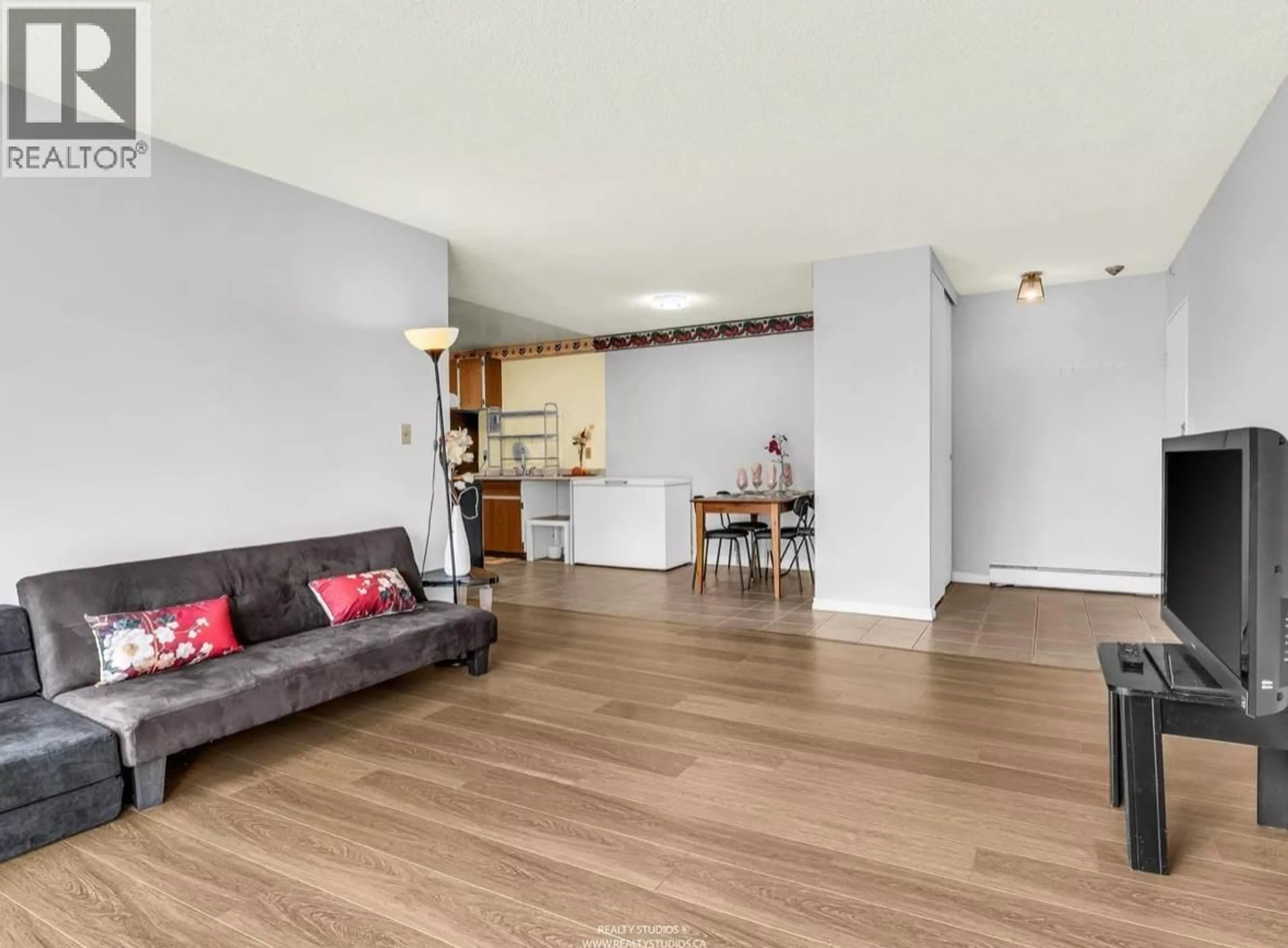 Living room with furniture, wood/laminate floor for 305 - 7260 LINDSAY ROAD, Richmond British Columbia V7C3M6