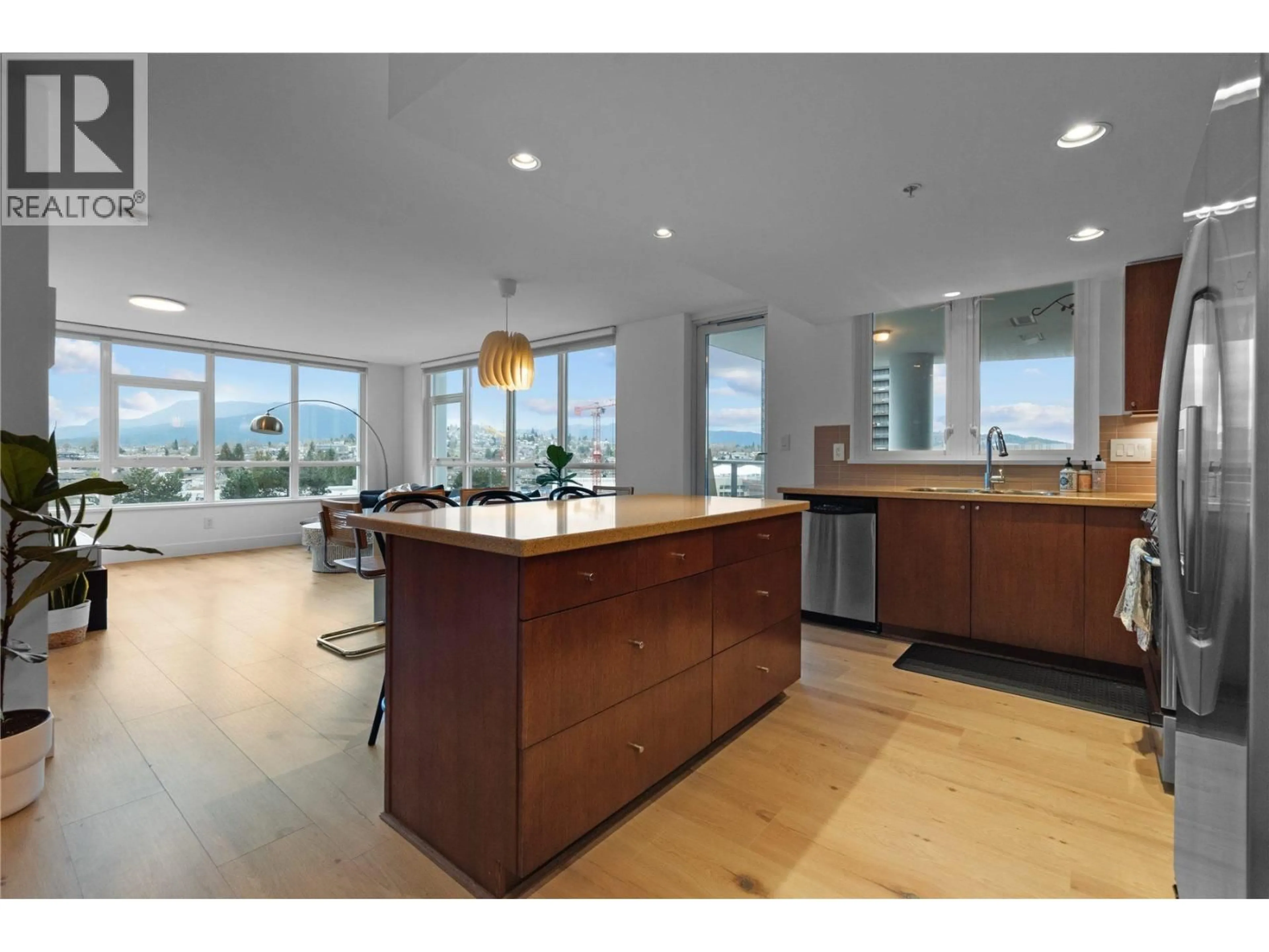 Open concept kitchen, wood/laminate floor for 1102 - 4400 BUCHANAN STREET, Burnaby British Columbia V5C0E3