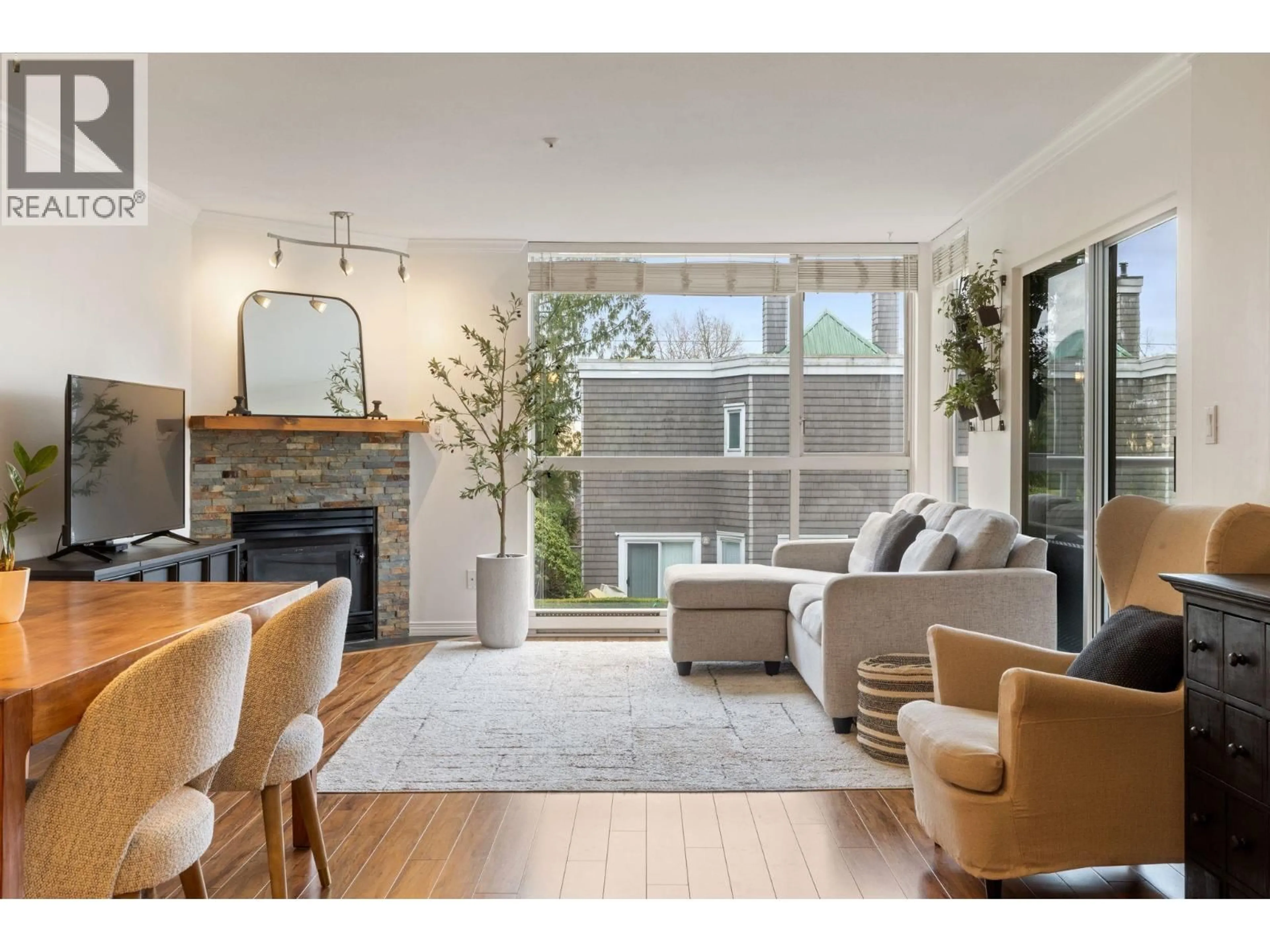 Living room with furniture, unknown for 212 - 8450 JELLICOE STREET, Vancouver British Columbia V5S4S9